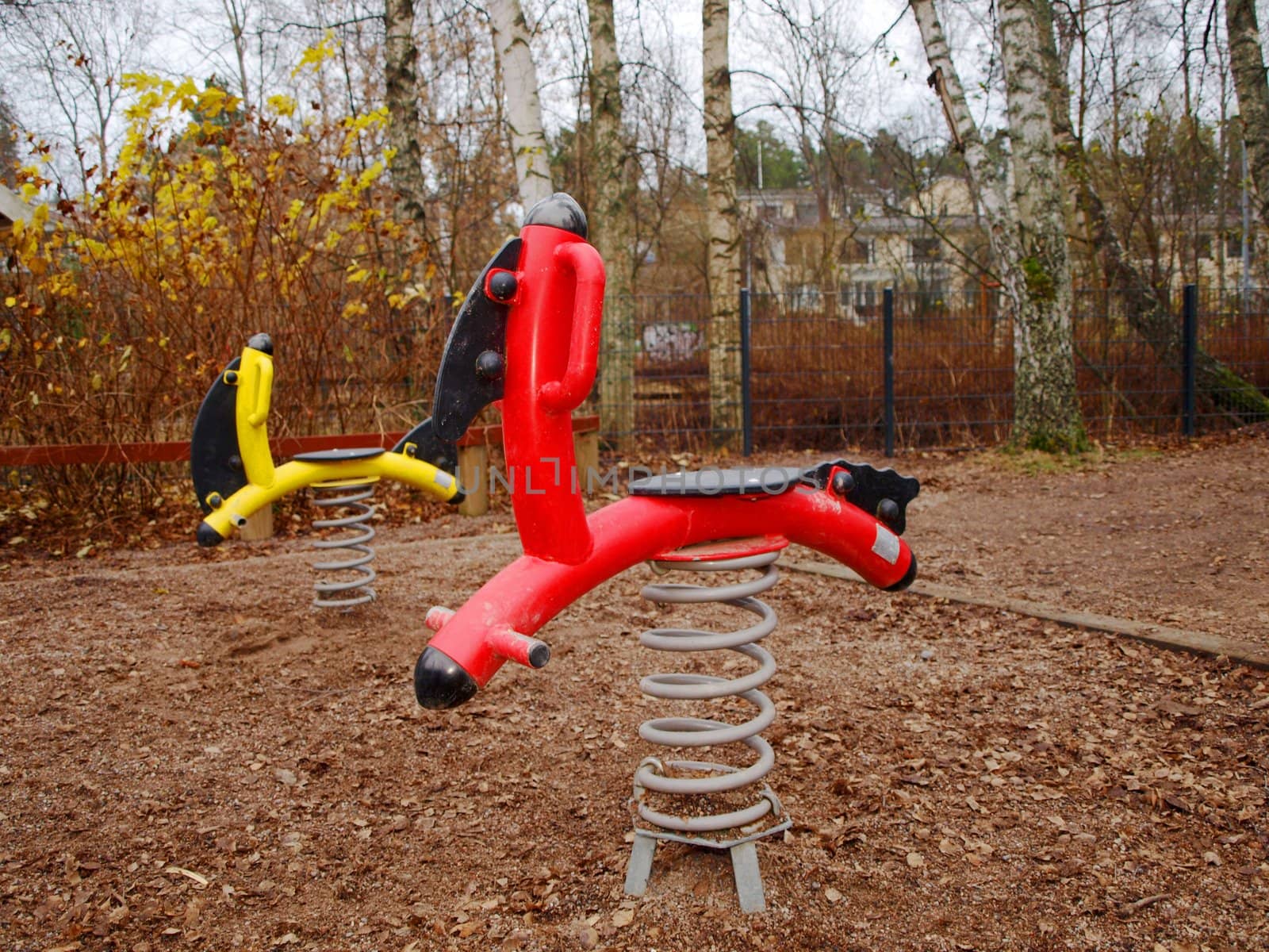 Steel horses, standing alone in a childrens playground