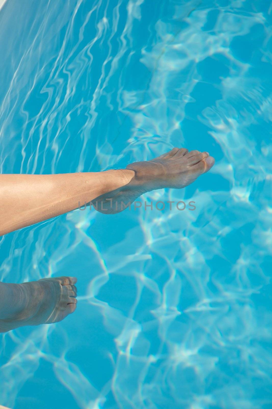 woman barefoot at swimming pool in Asturias Spain