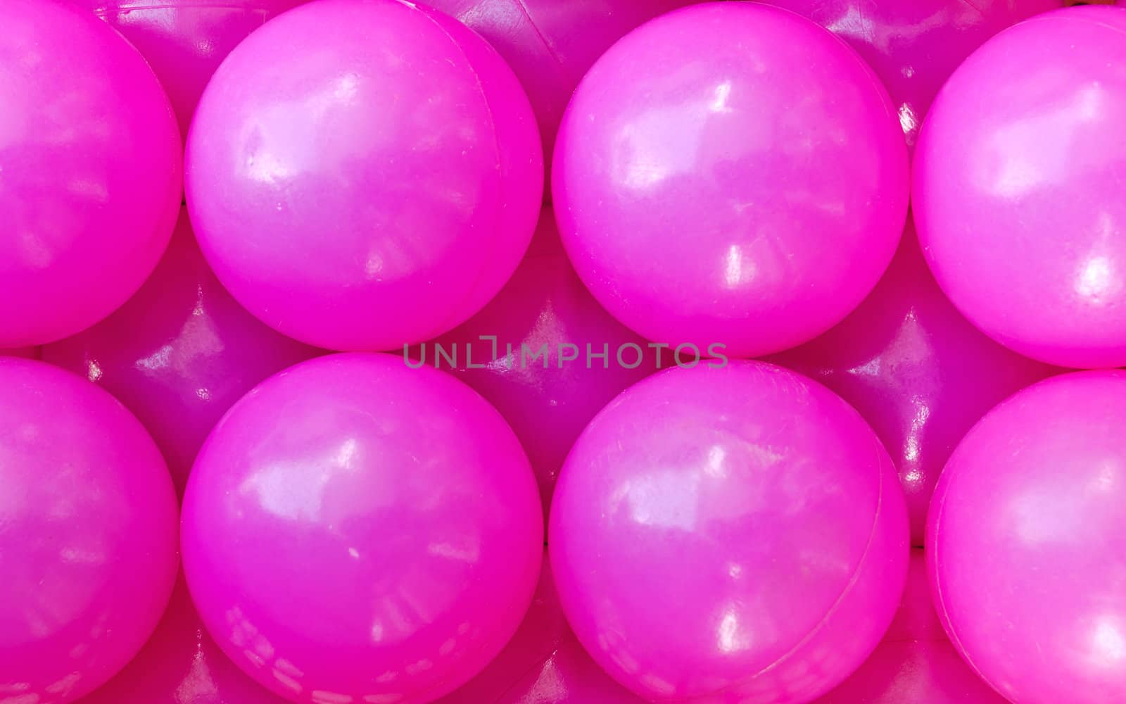 Rows of pink plastic balls