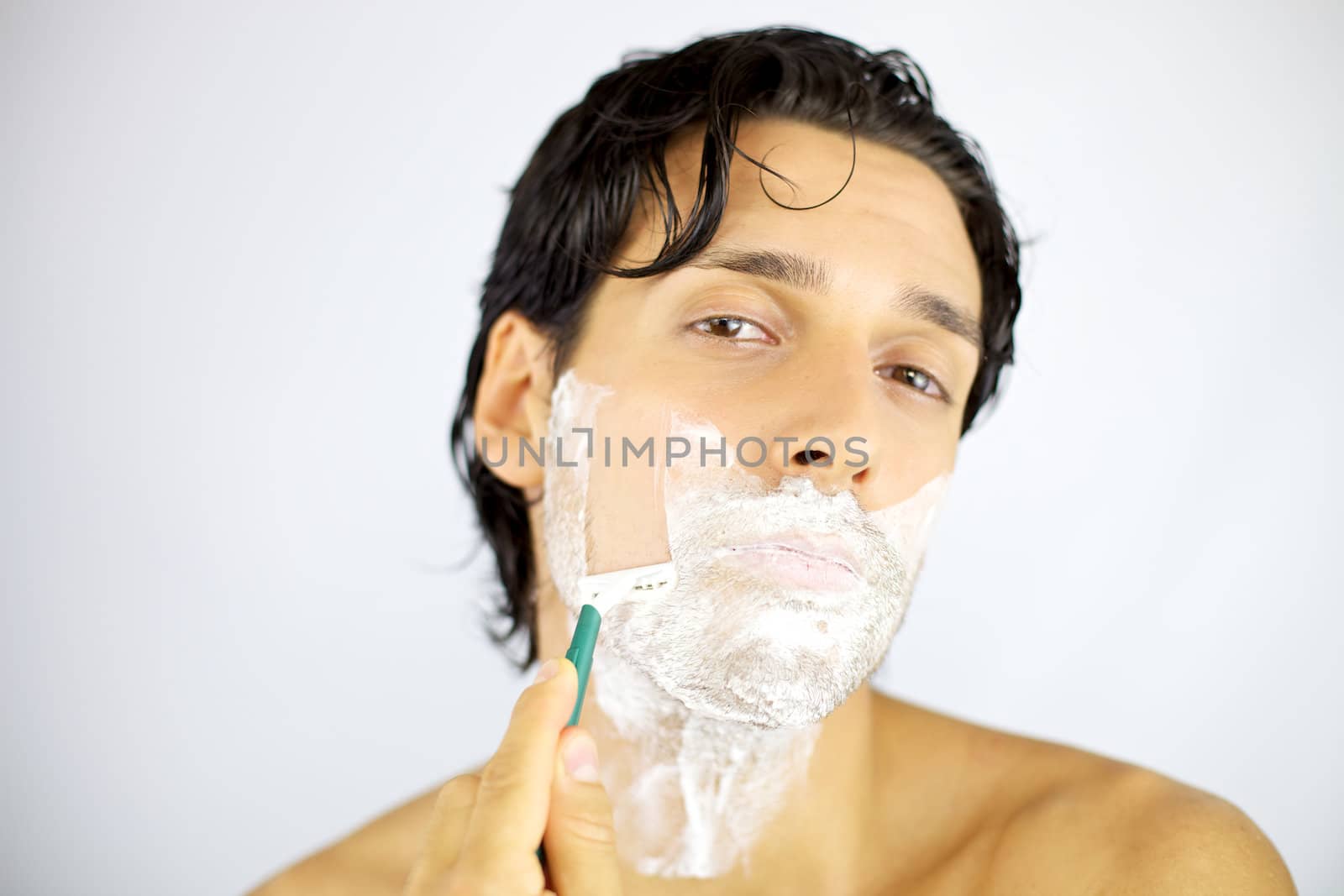 Young handsome man shaving z by fmarsicano
