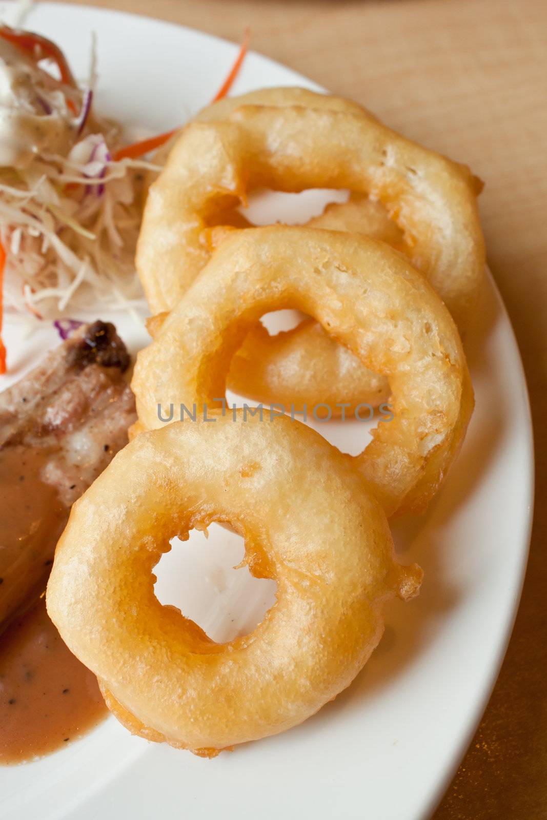 Fries onion ring in steak plate