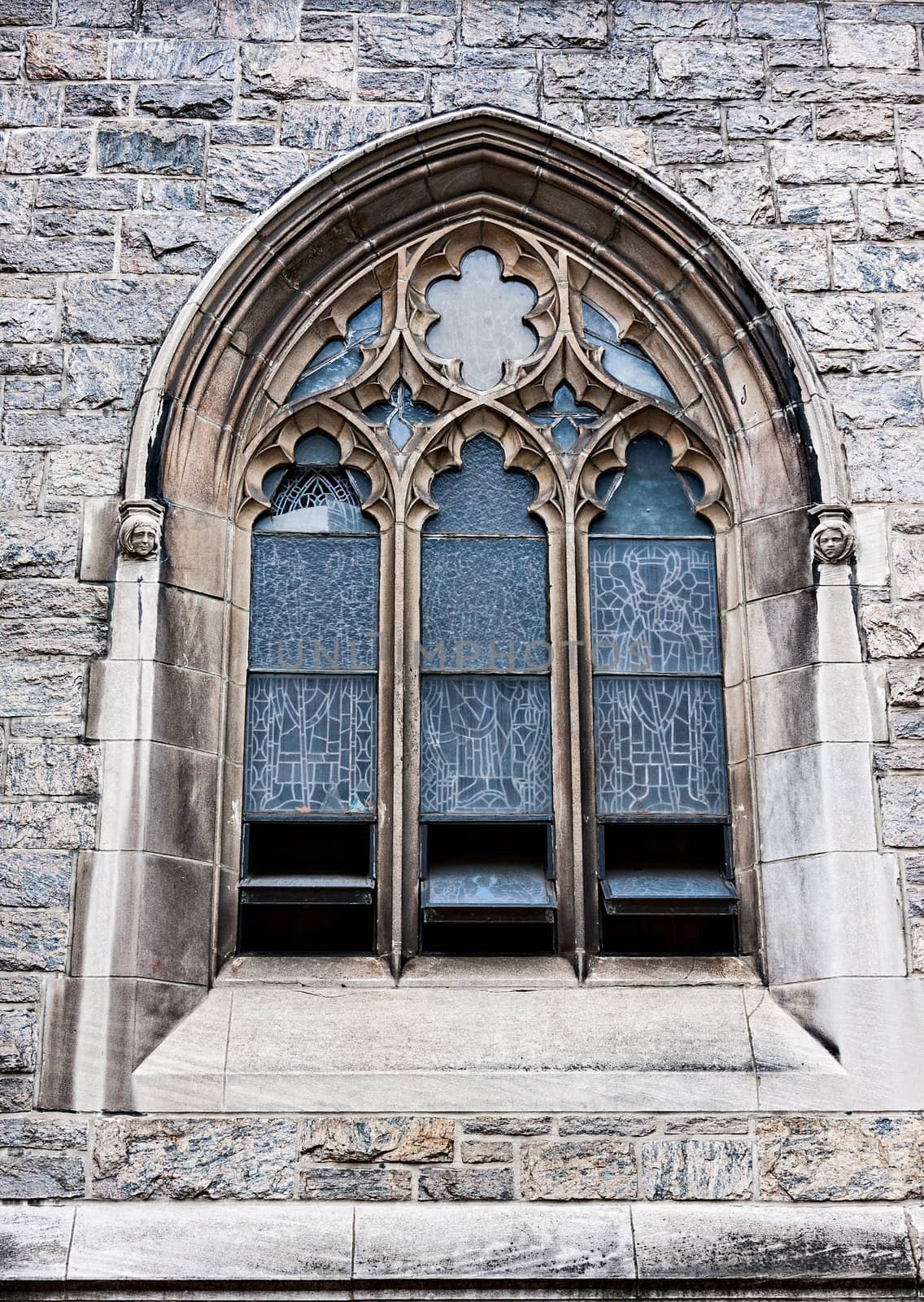 An old church window showing much detail and texture