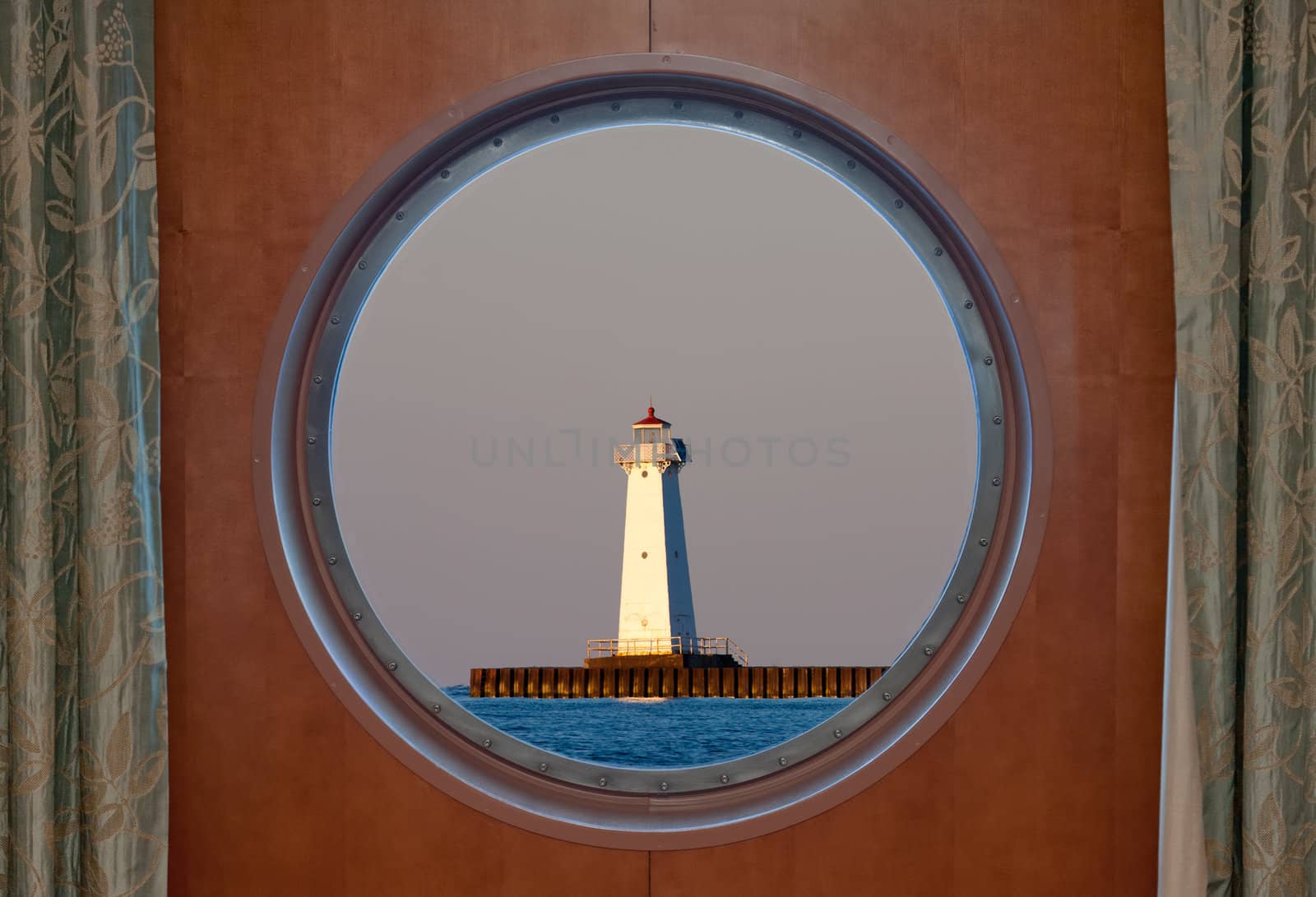Sodus Bay Lighthouse on Lake Ontario as seen through a porthole. 