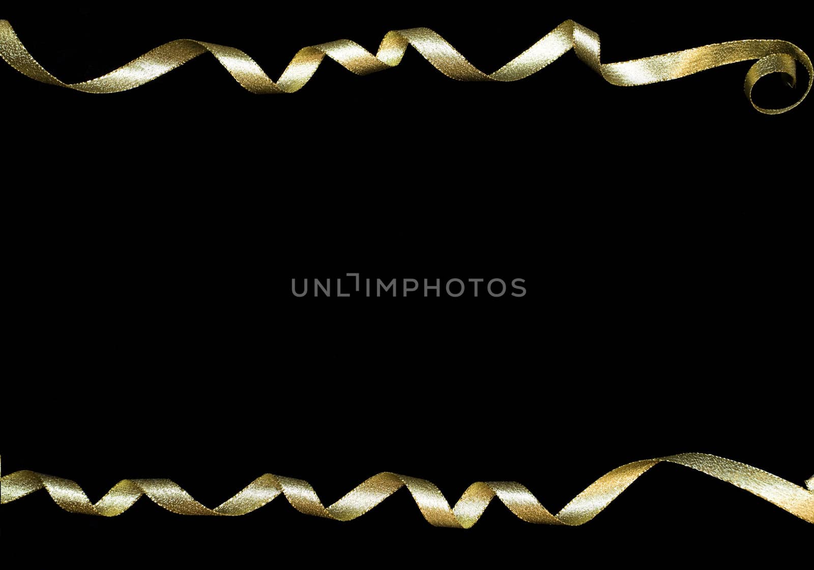 Gold curly ribbons on black