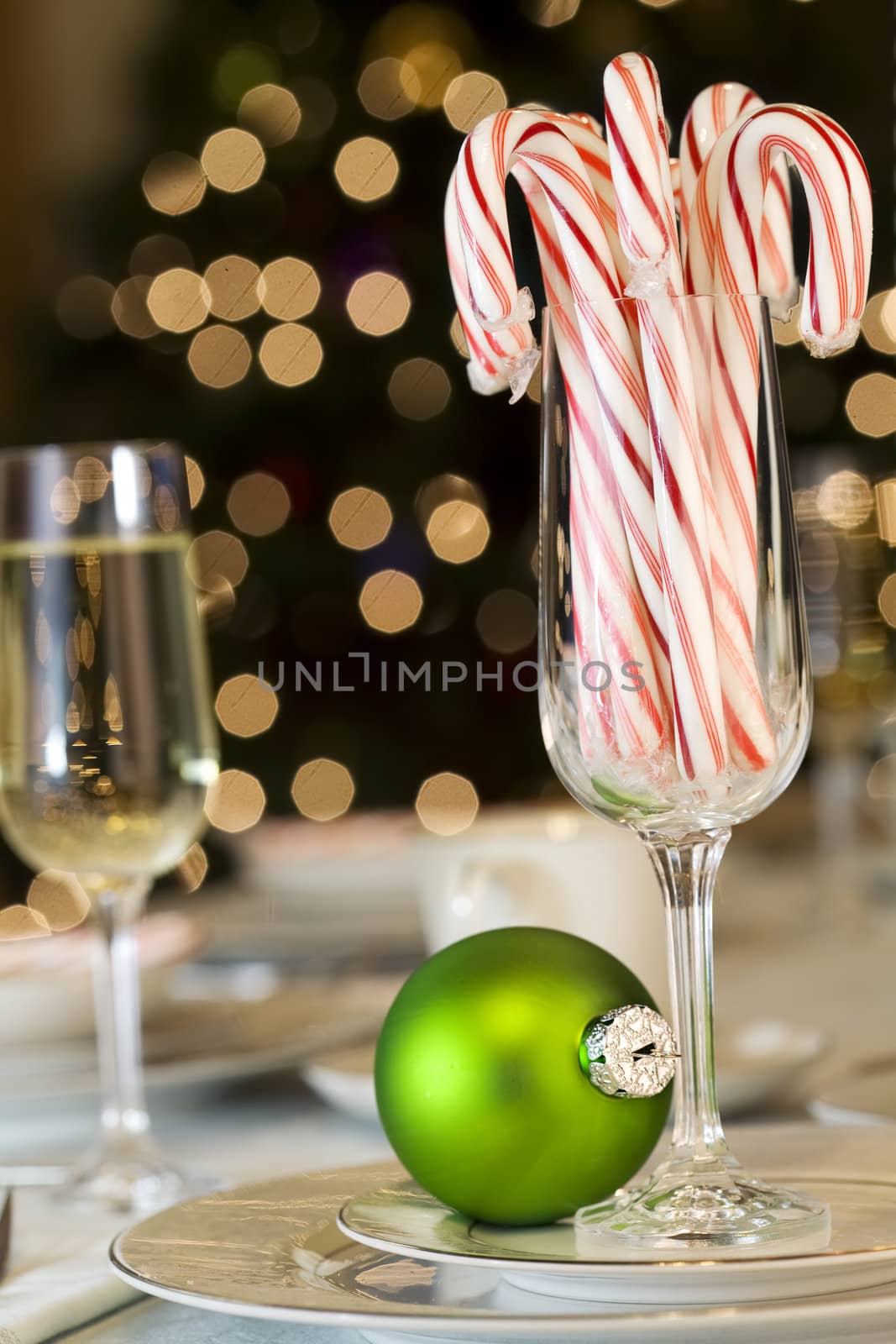 Candy canes and ornaments as Christmas table decorations by jarenwicklund
