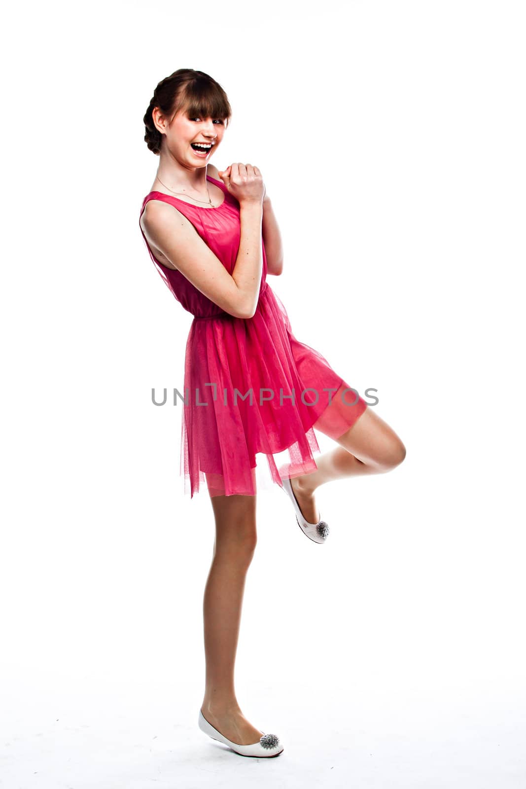 Young and funny girl in a red dress