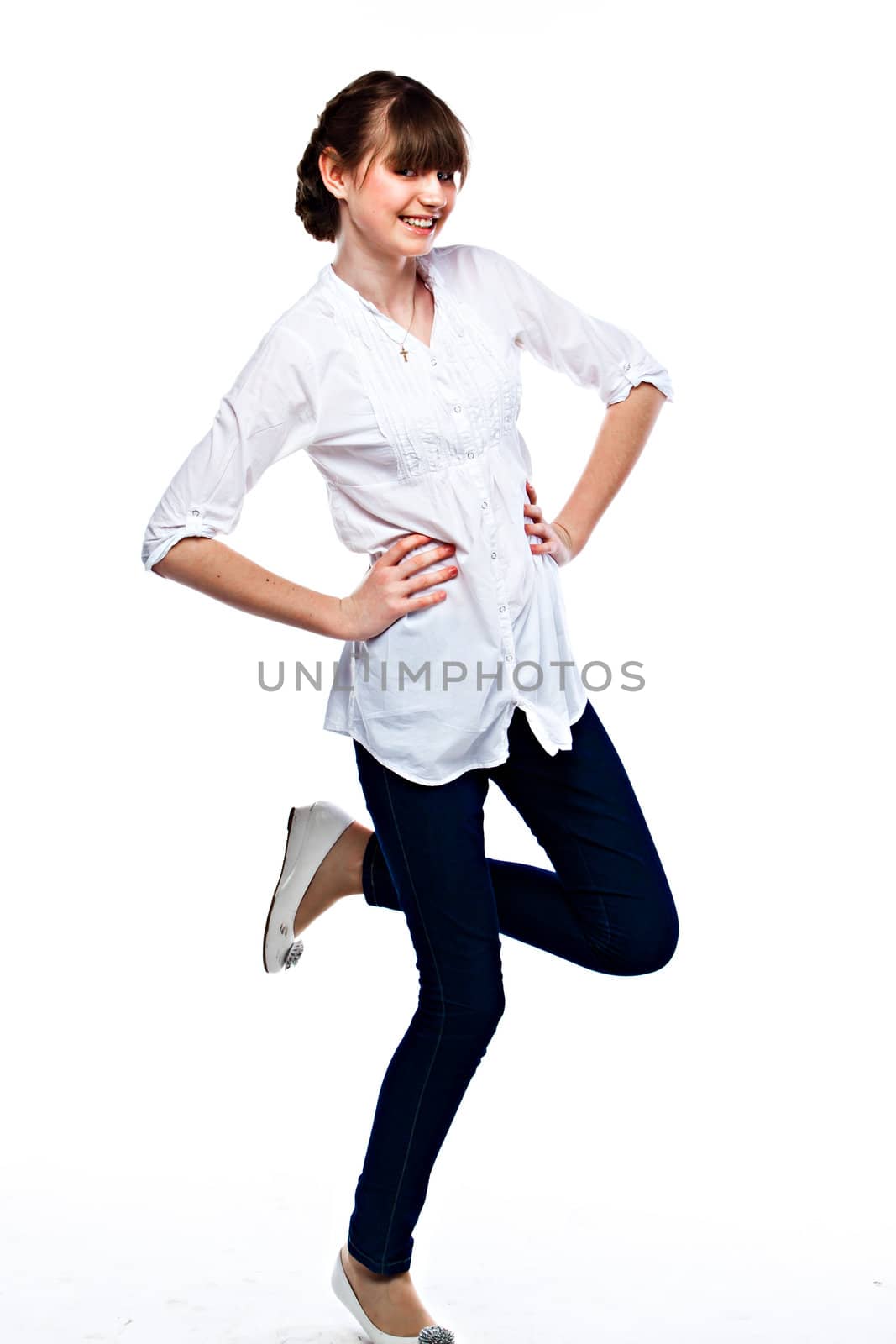 Young and funny girl in a white shirt and dark blue jeans