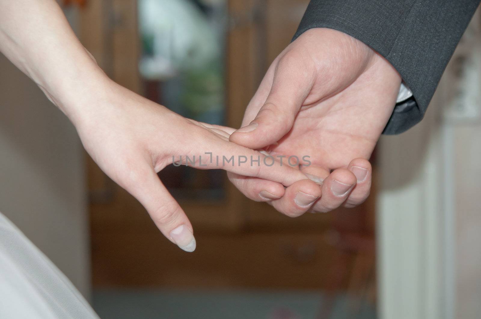 close-up of hands of women and men who were married