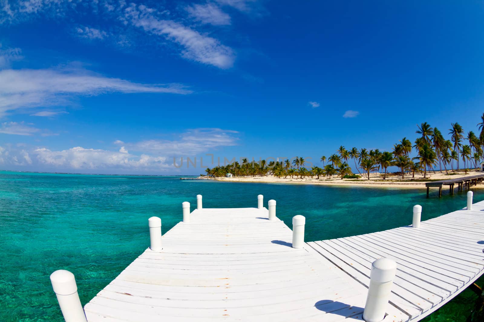 white jetty on tropical island, Belize.