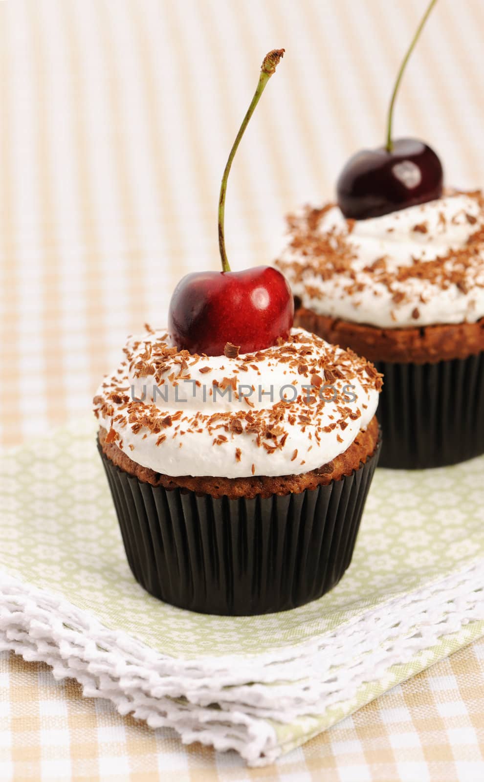 Cupcakes with whipped cream and cherry by haveseen