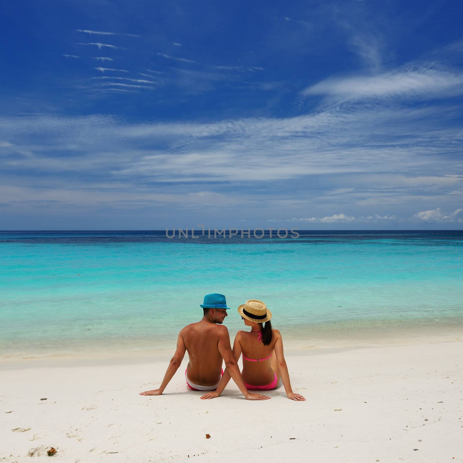 Couple on a beach by haveseen