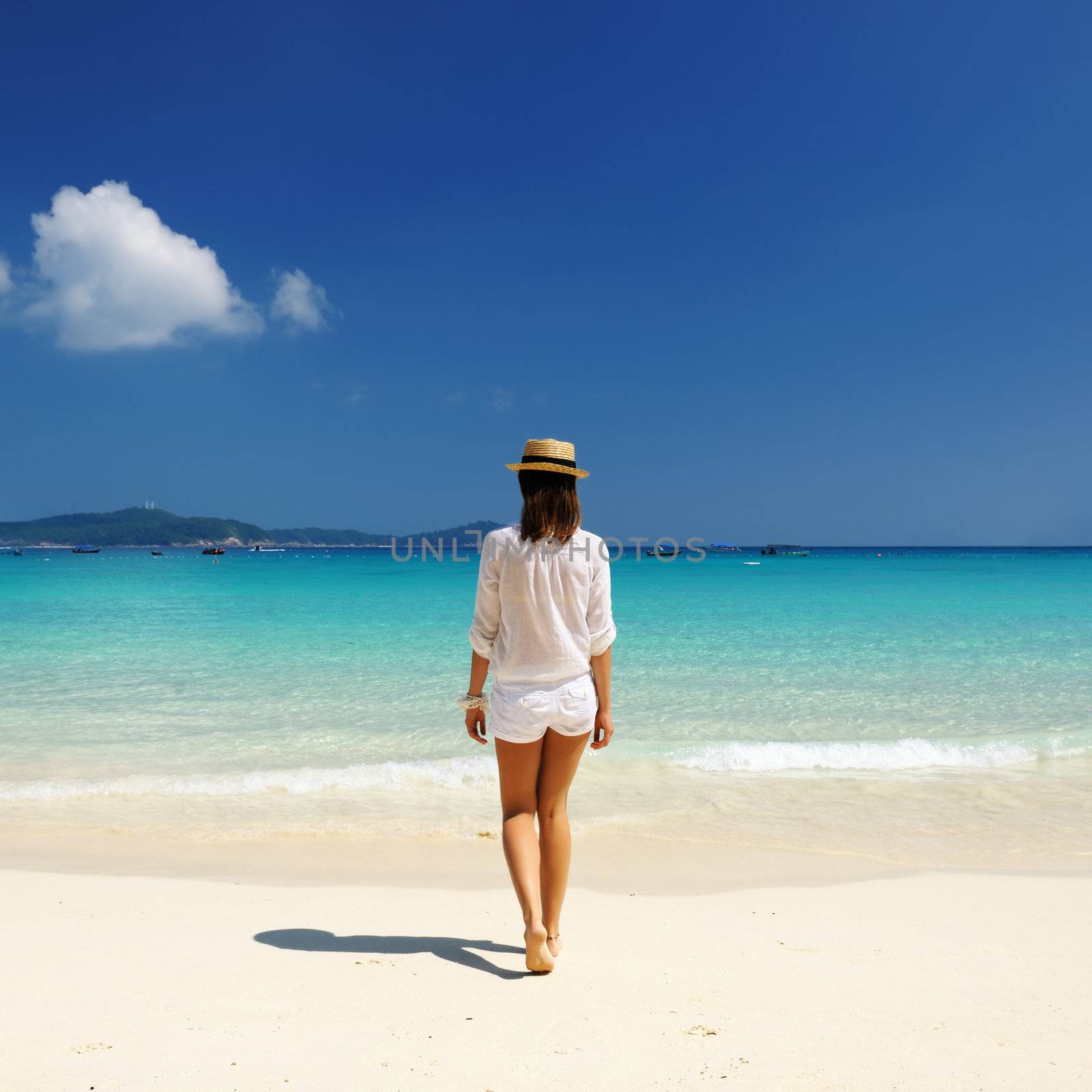 Woman in hat at beach