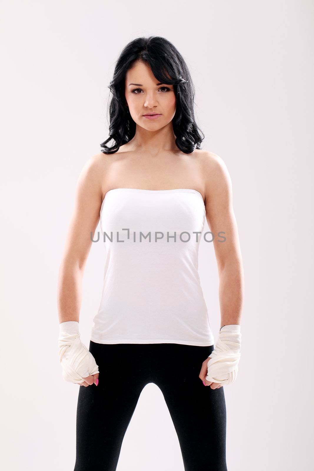 Portrait of Cute fitness girl with bandages on her hands
