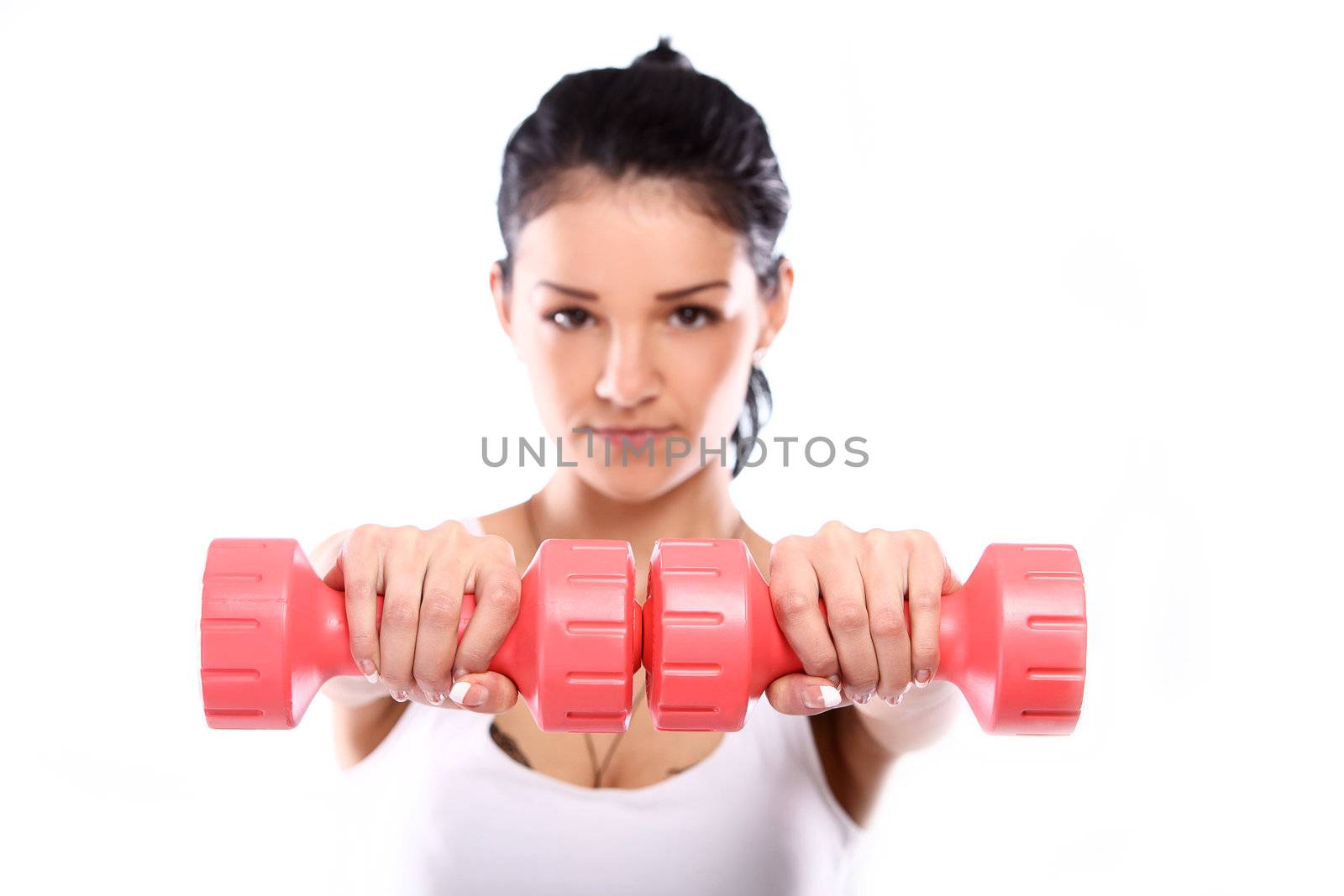 Cute and young girl do exercises with red dumbbells