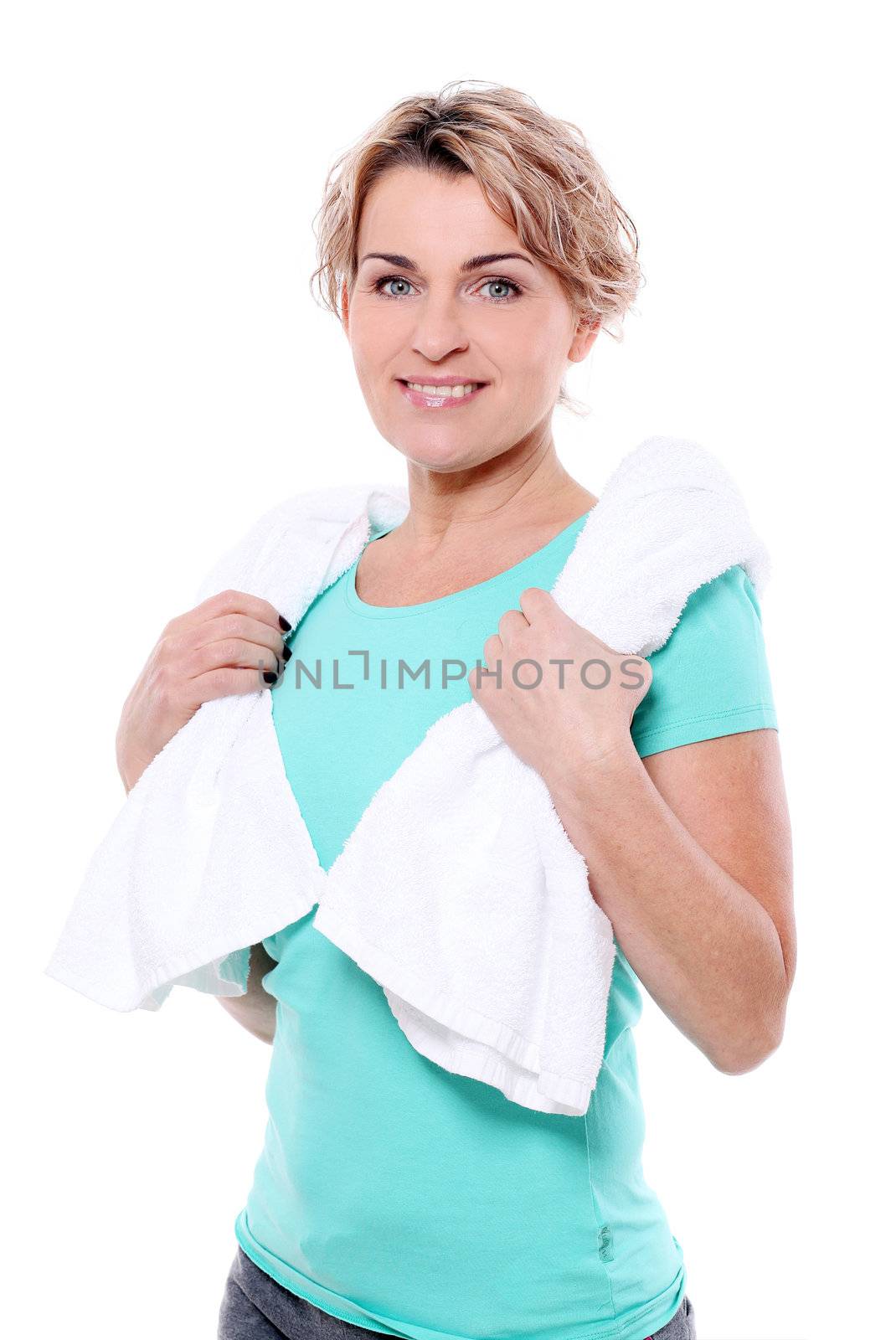 Beautiful mid aged woman with towel isolated on a white