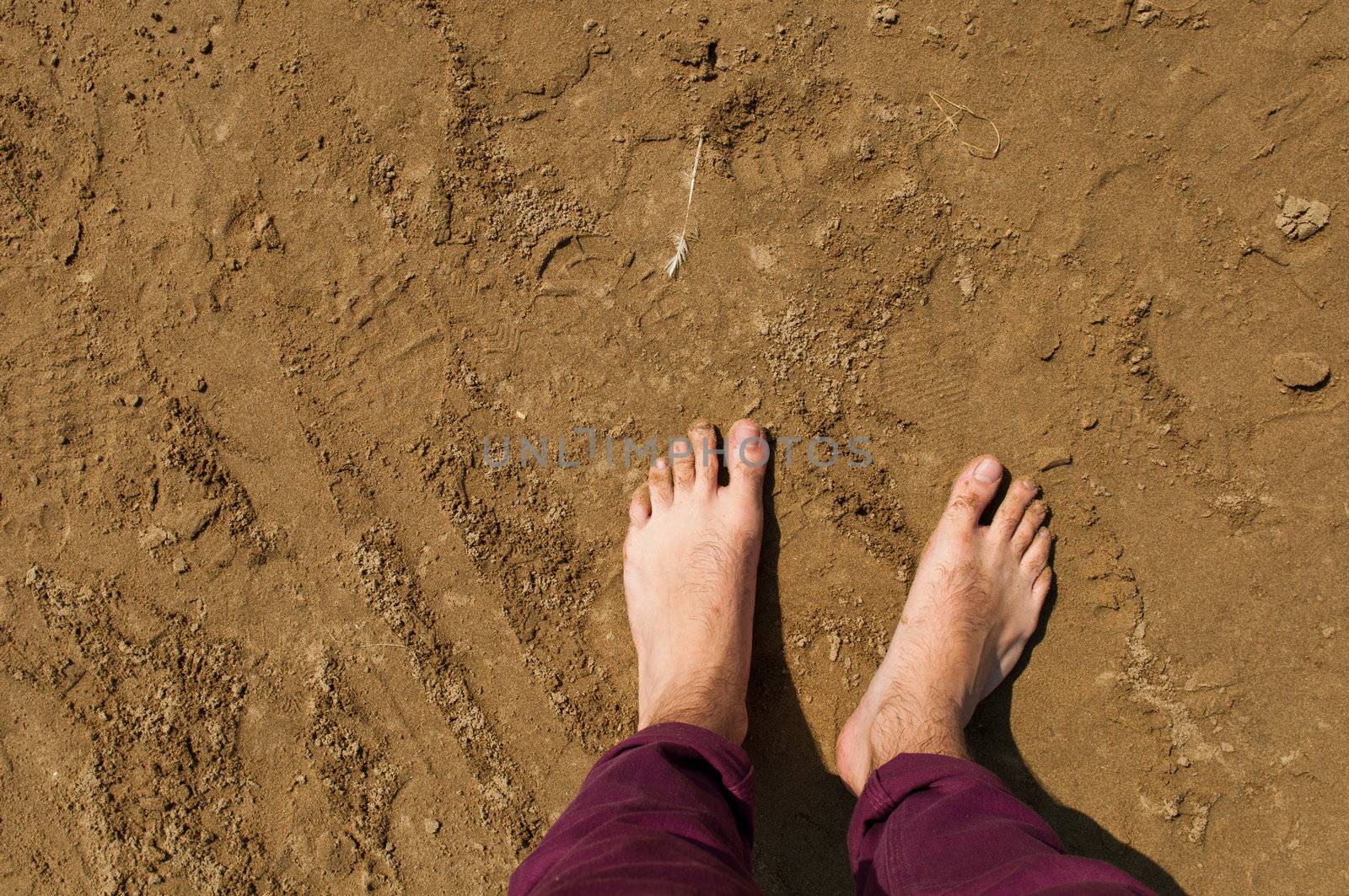 young man barefoot on a beach in Weston-super-Mare, United Kingdom