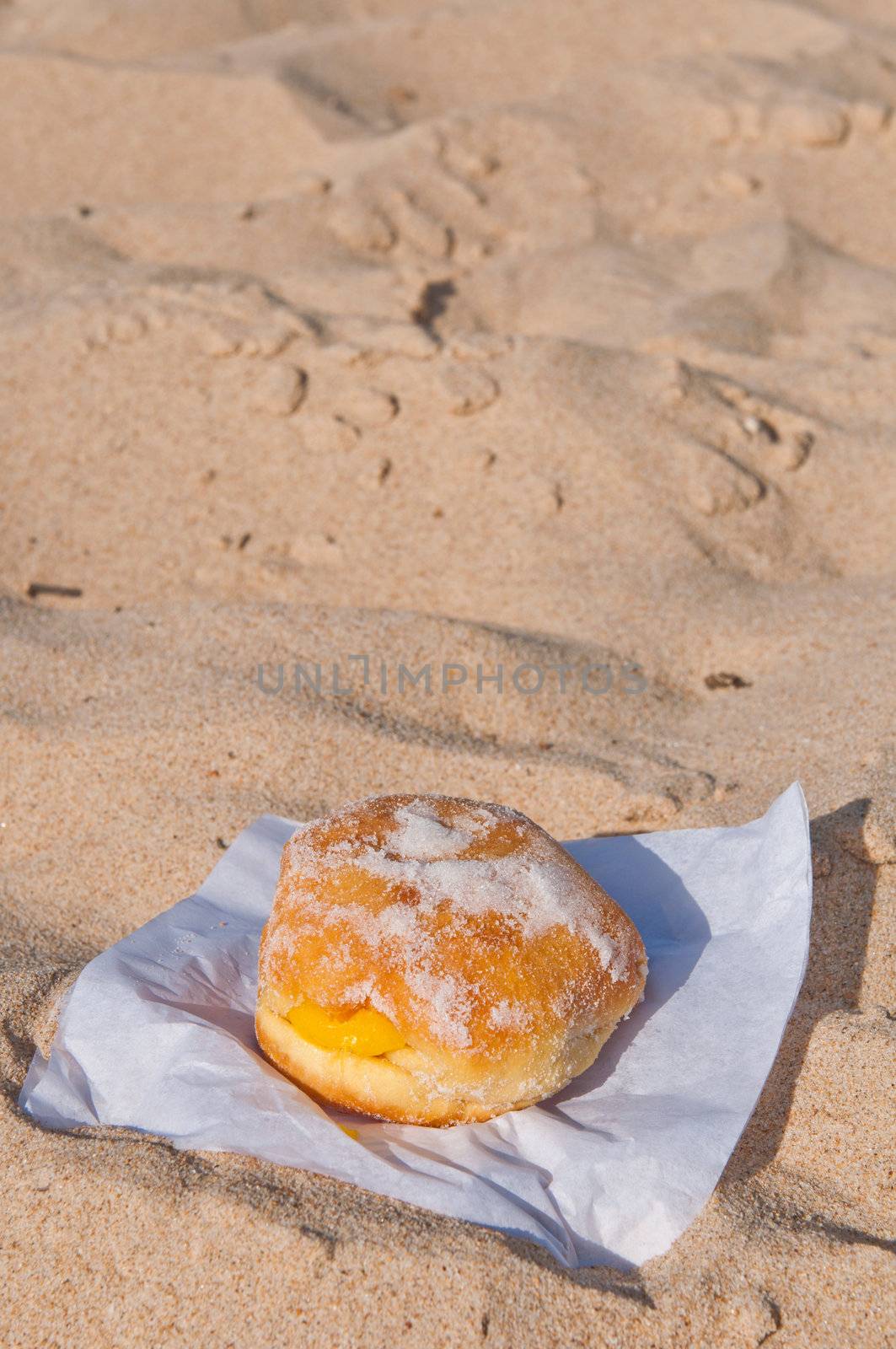 berliner ball on a sandy beach in Algarve, Portugal (traditionally sold during all summer)