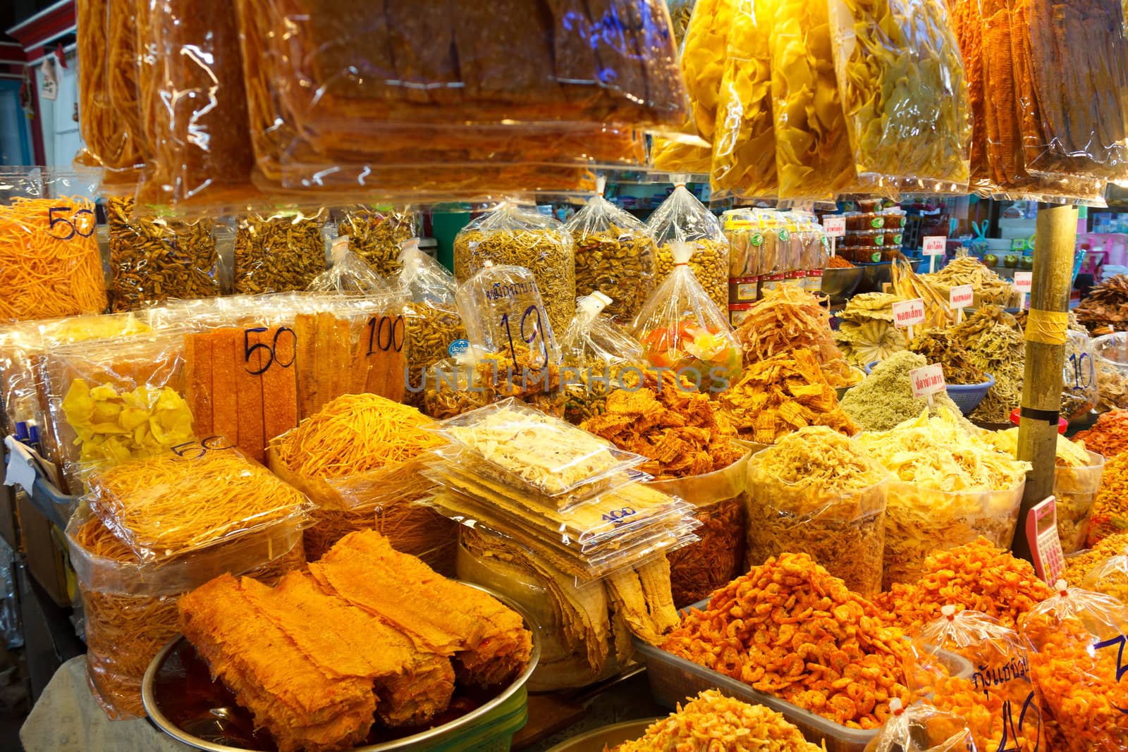 Dried foodstuff, squids and other seafood, sale at market in Thailand.