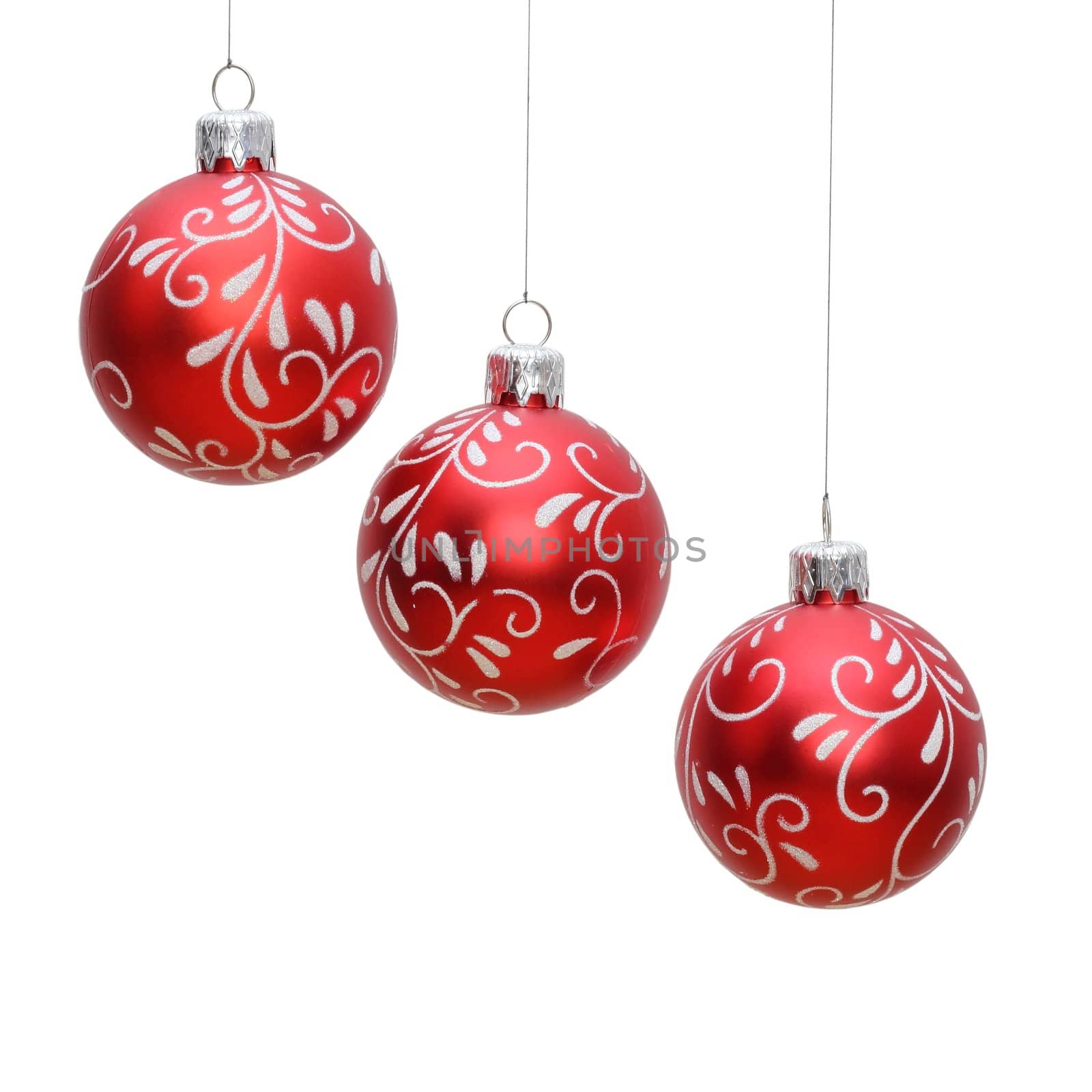 three hanging red christmas balls isolated over white background