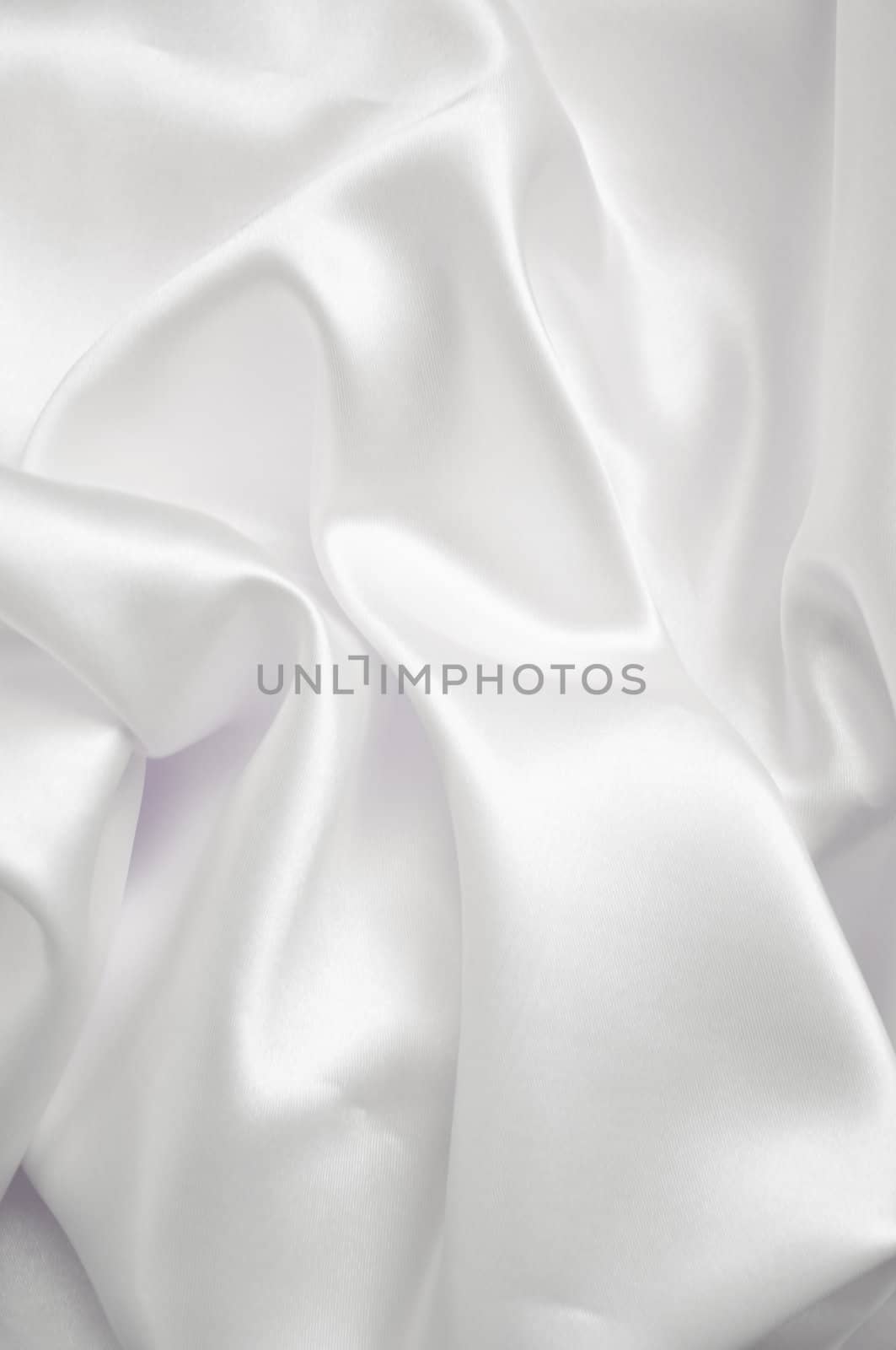 White smooth fabric background with shine.