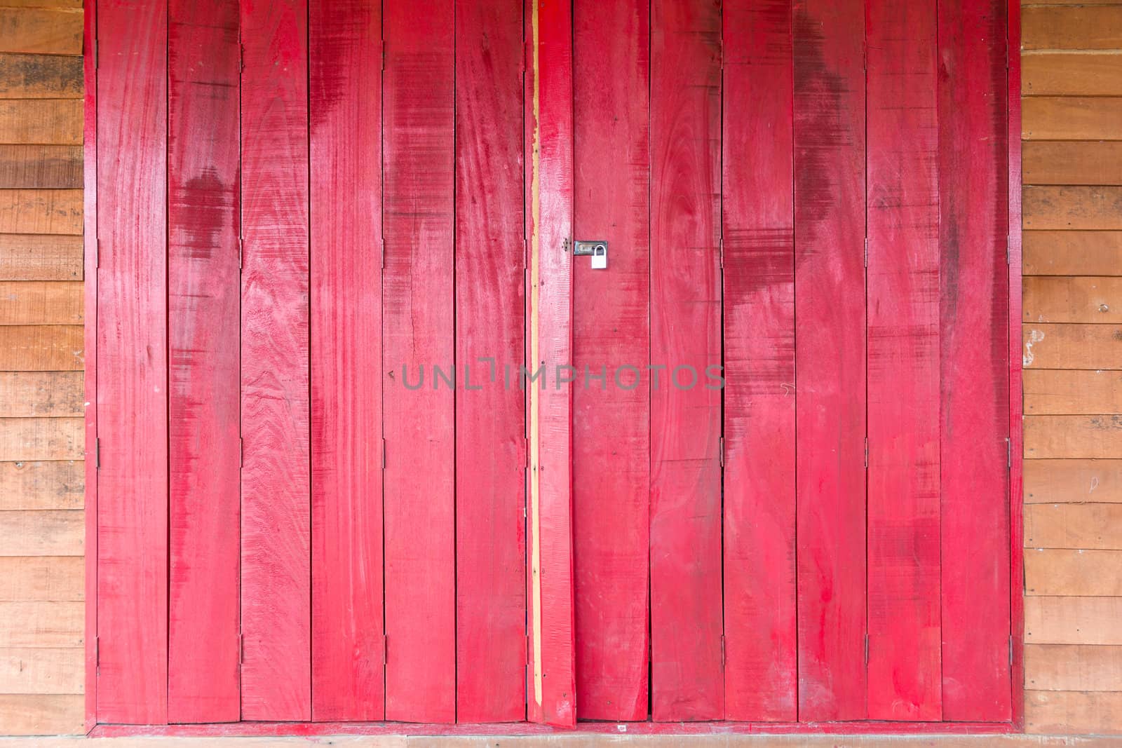 Old wooden red door, use as background texture.