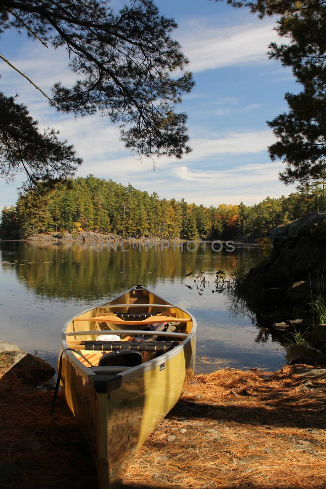 Yellow canoe and calm lake in Killaney Provincial Park, Ontario, Canada
