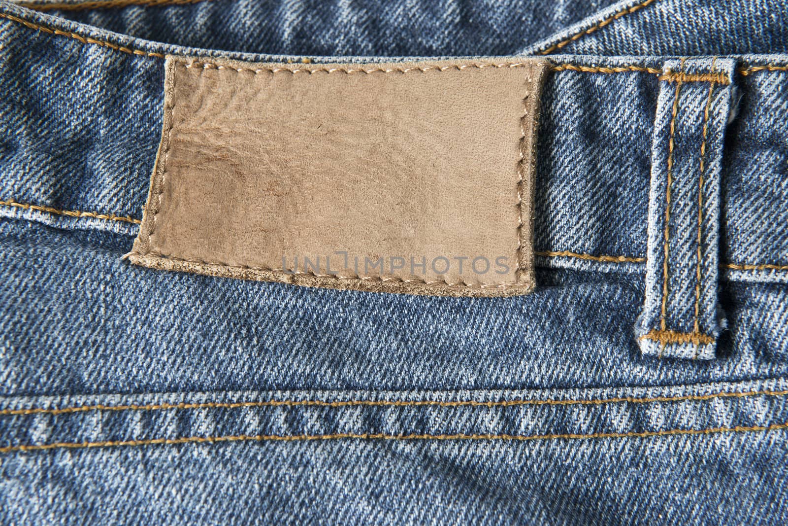 Jeans with empty leather label by angelsimon