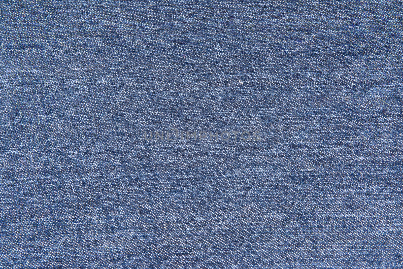 Old blue jeans pattern background by angelsimon