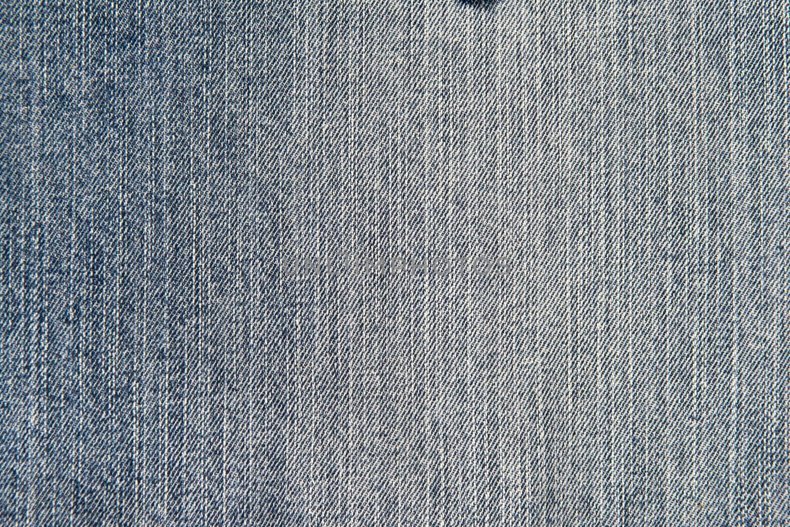 Old and worn blue jeans pattern background in a king size
