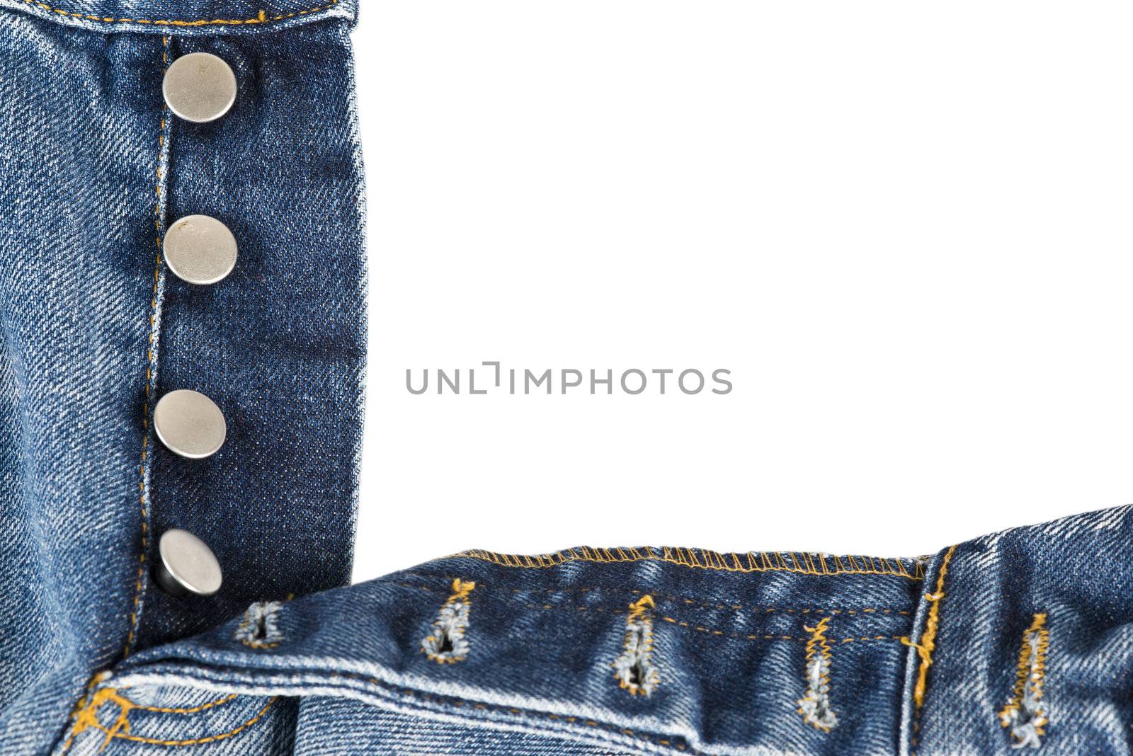 Fly of the blue  jeans with button closure over a white background