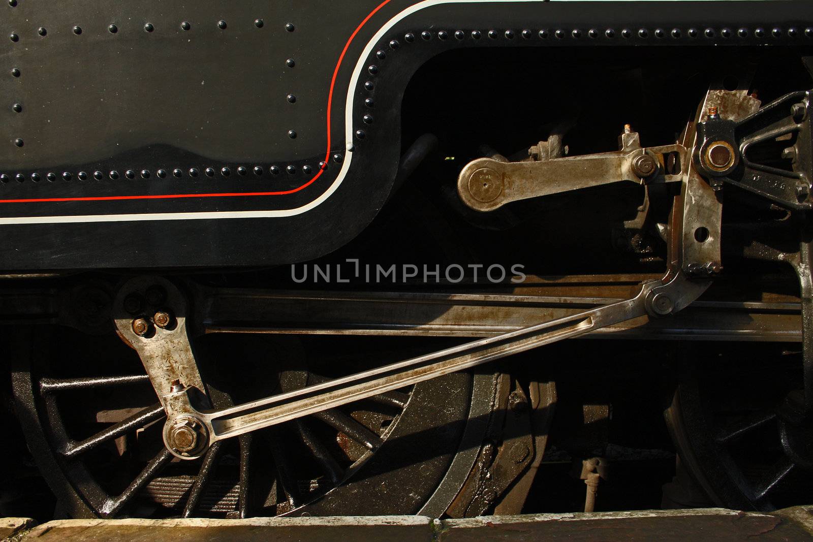 View of drive shaft and brake pad of a steam engine locomotive
