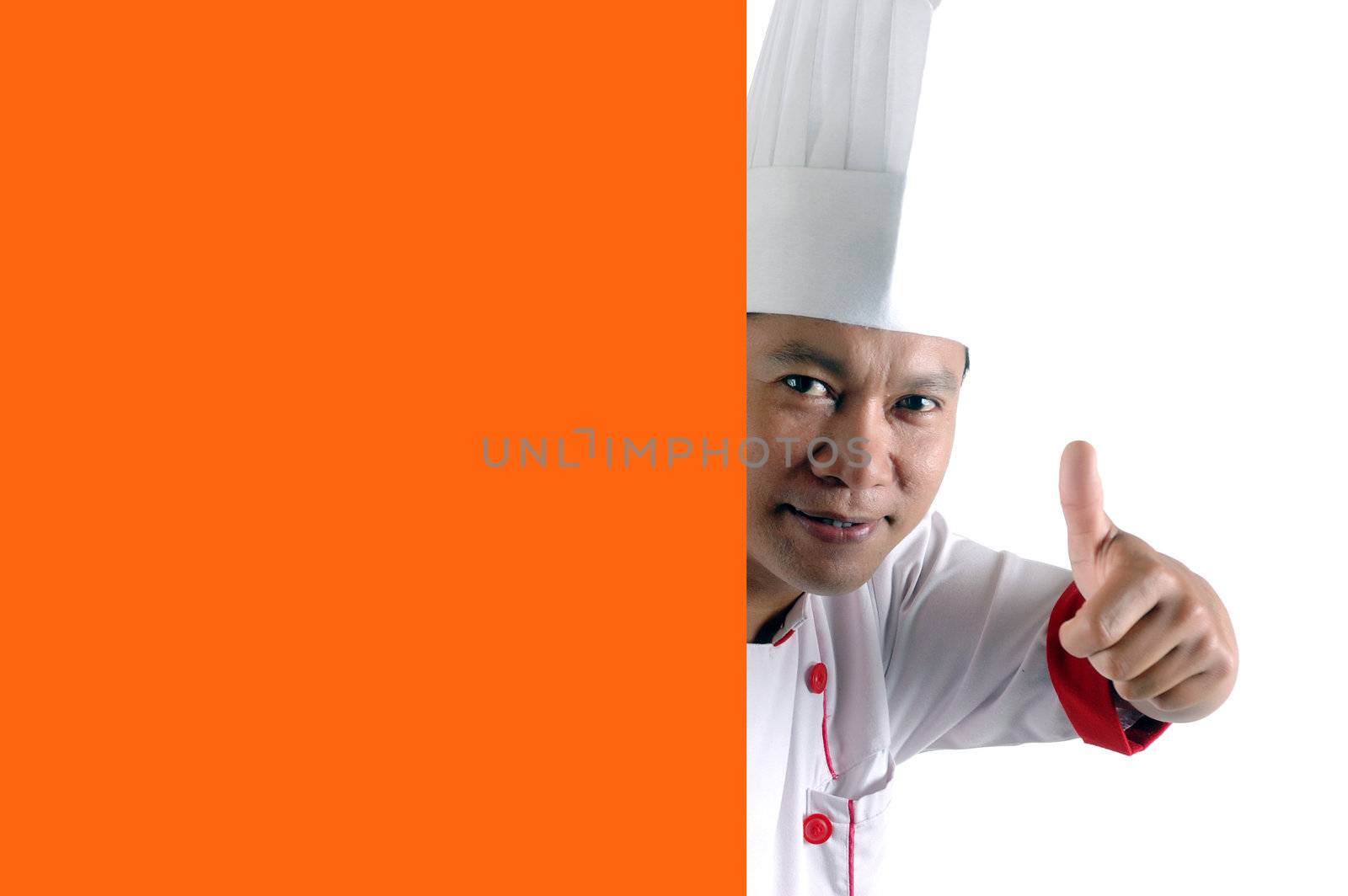 chef gives thumbs up sign with orange blank space isolated on white background