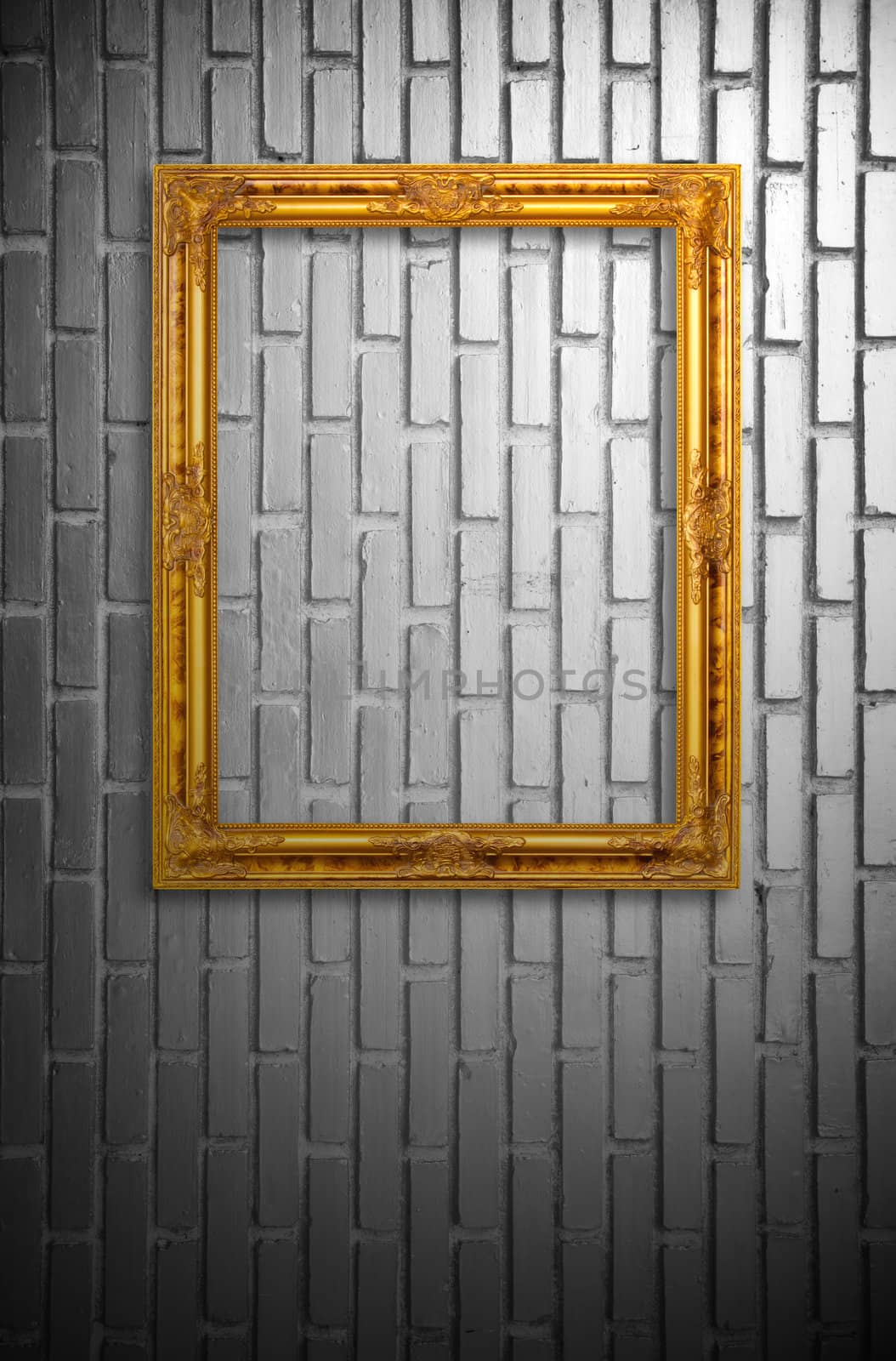 gold frame on the black and white brickwall