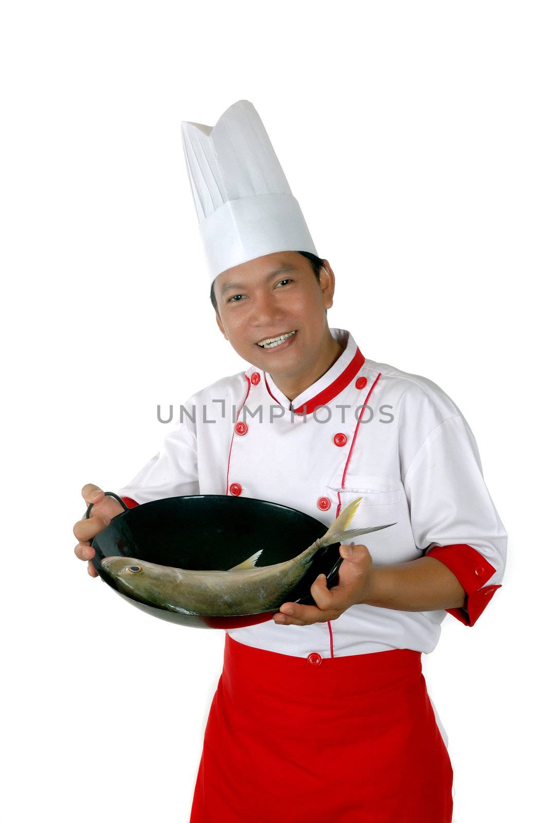 chef present raw fish on a black frying isolated on white background