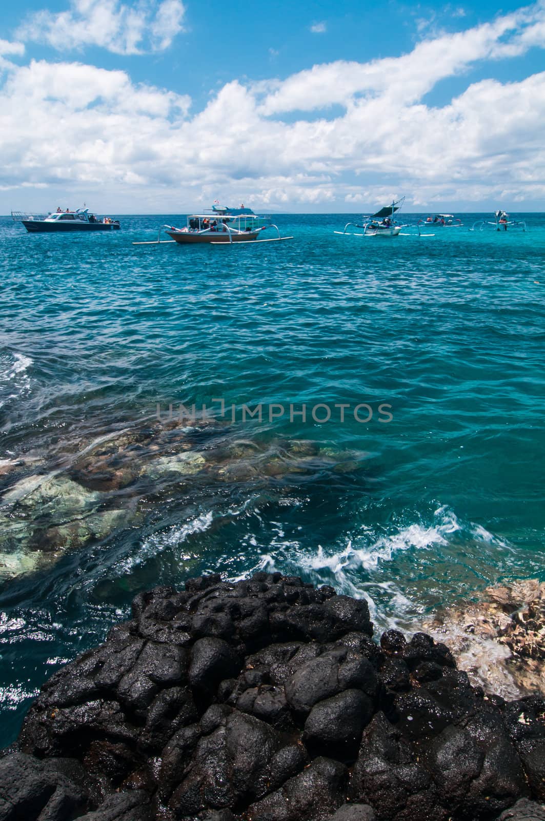 Many boats on tropical beach. Padangbai, Bali, Indonesia.