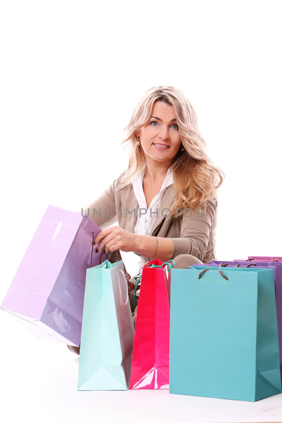 Beautiful middle aged woman checking her shopping bags