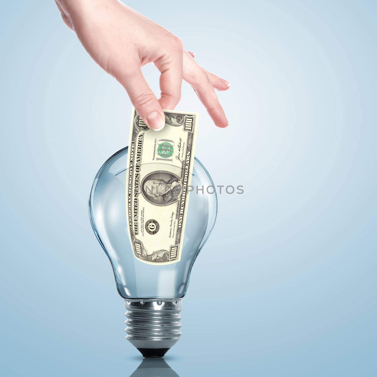 Money inside an electric light bulb by sergey_nivens