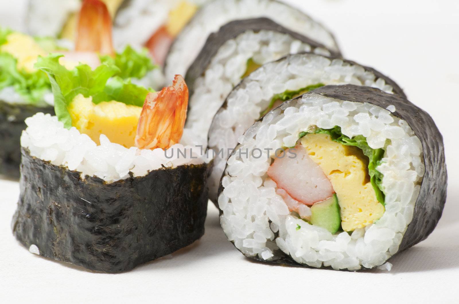 close-up shot of traditional fresh japanese sushi rolls, focus on the front piece