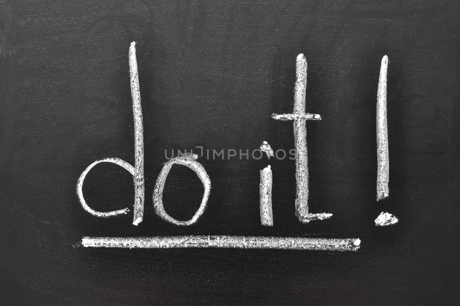 handwritten motivation words - Do it! on the school blackboard