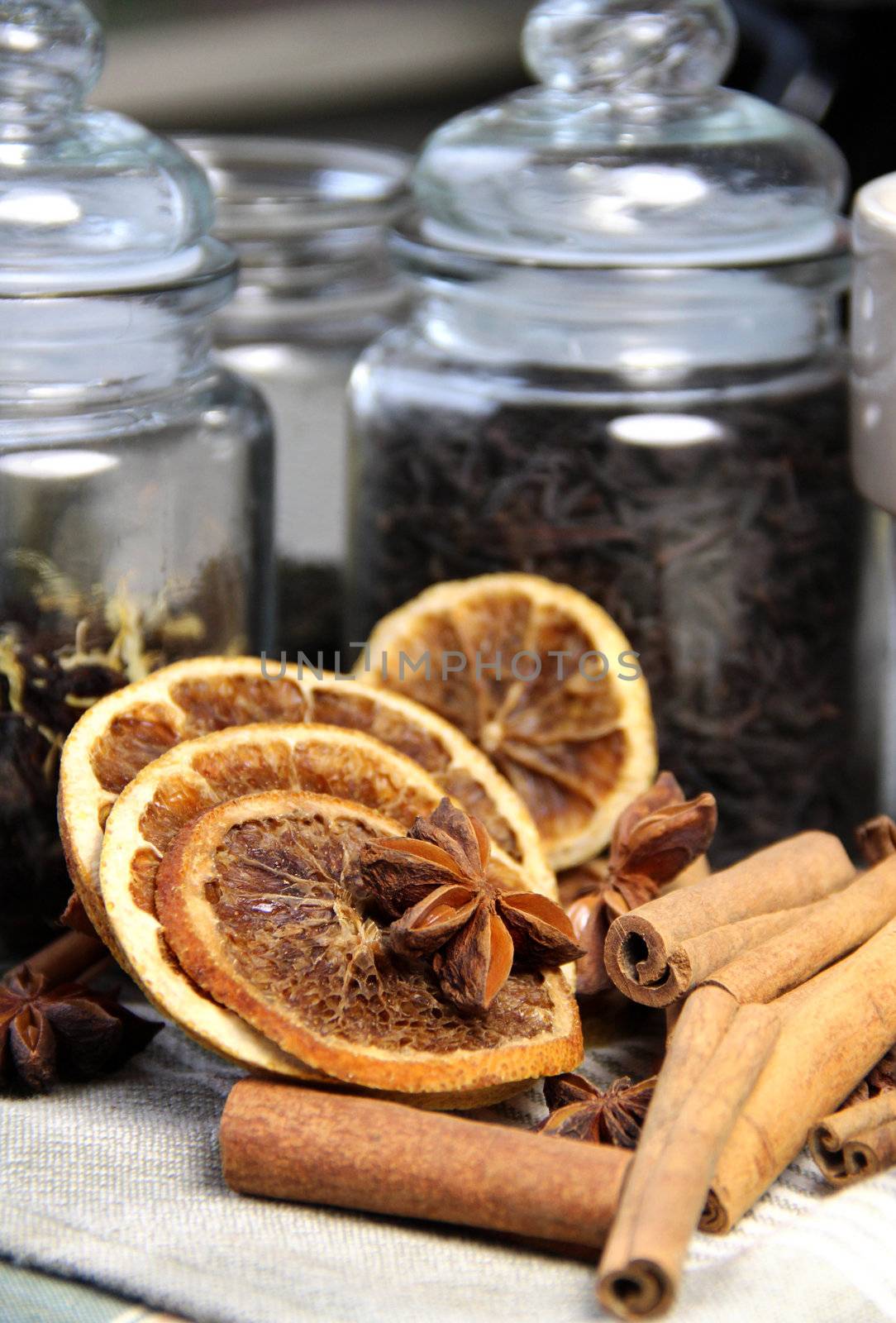 Tea leafs, cinnamon sticks and dry orange by tanouchka