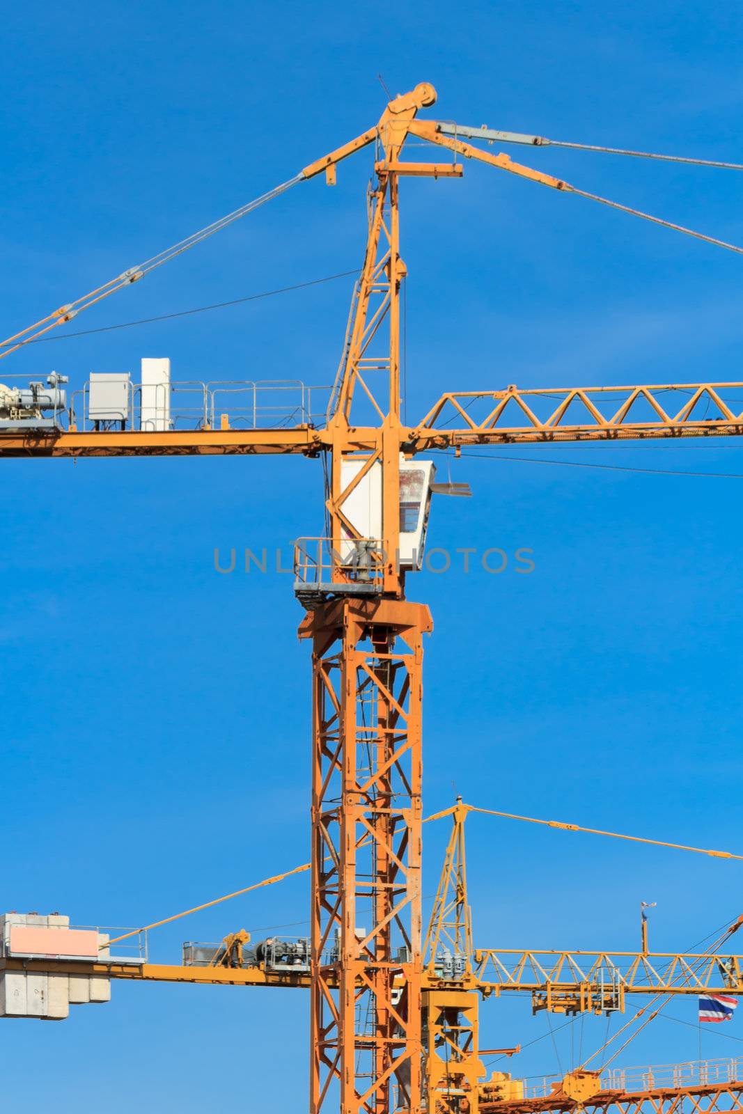 Construction crane with the cleared blue sky.