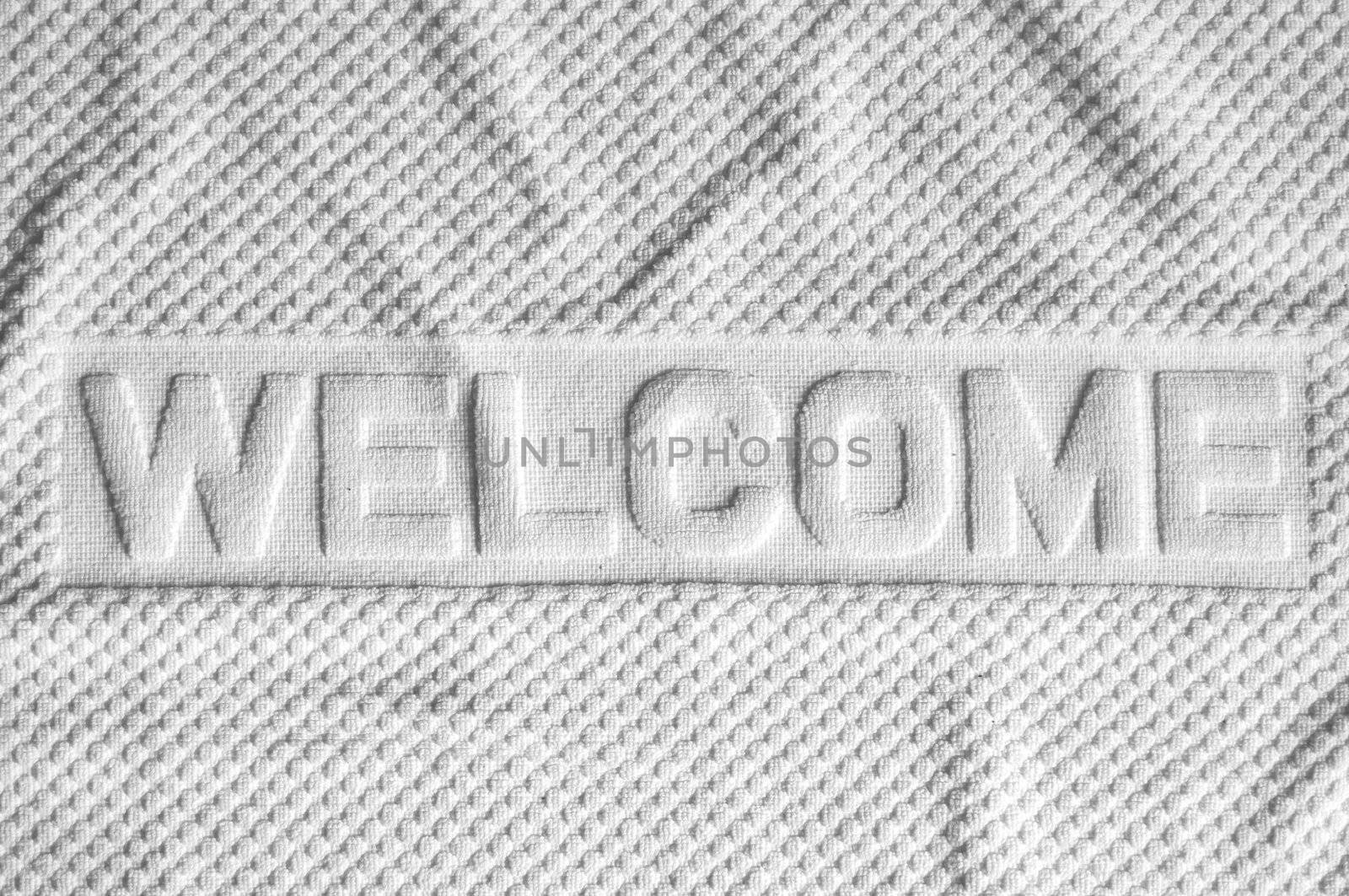 White welcome mat made from fabric