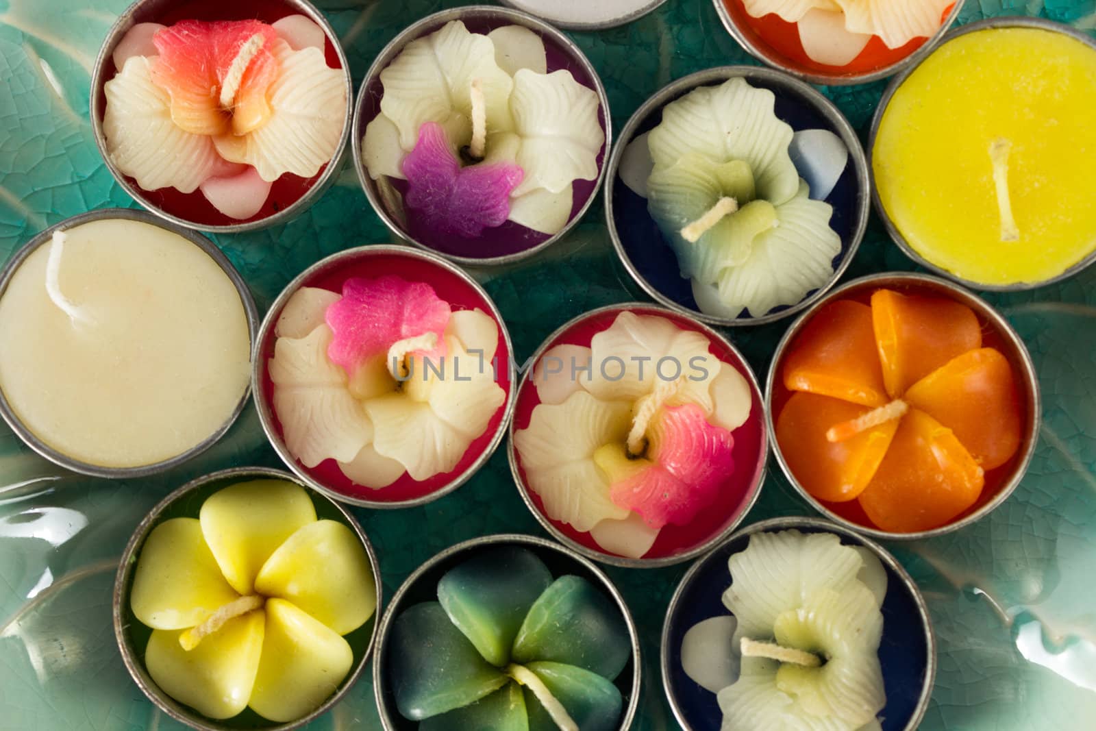 Close-up group of colorful flower shaped candles.