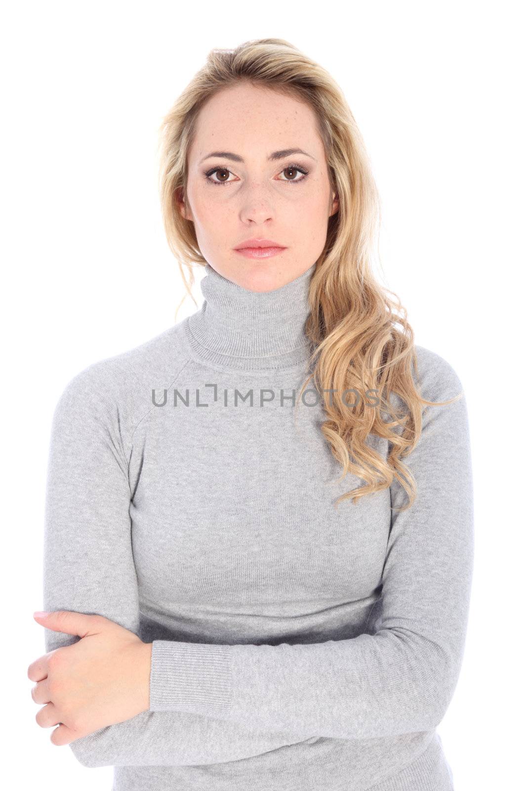 Fashion model in turtle neck shirt shows serious face.