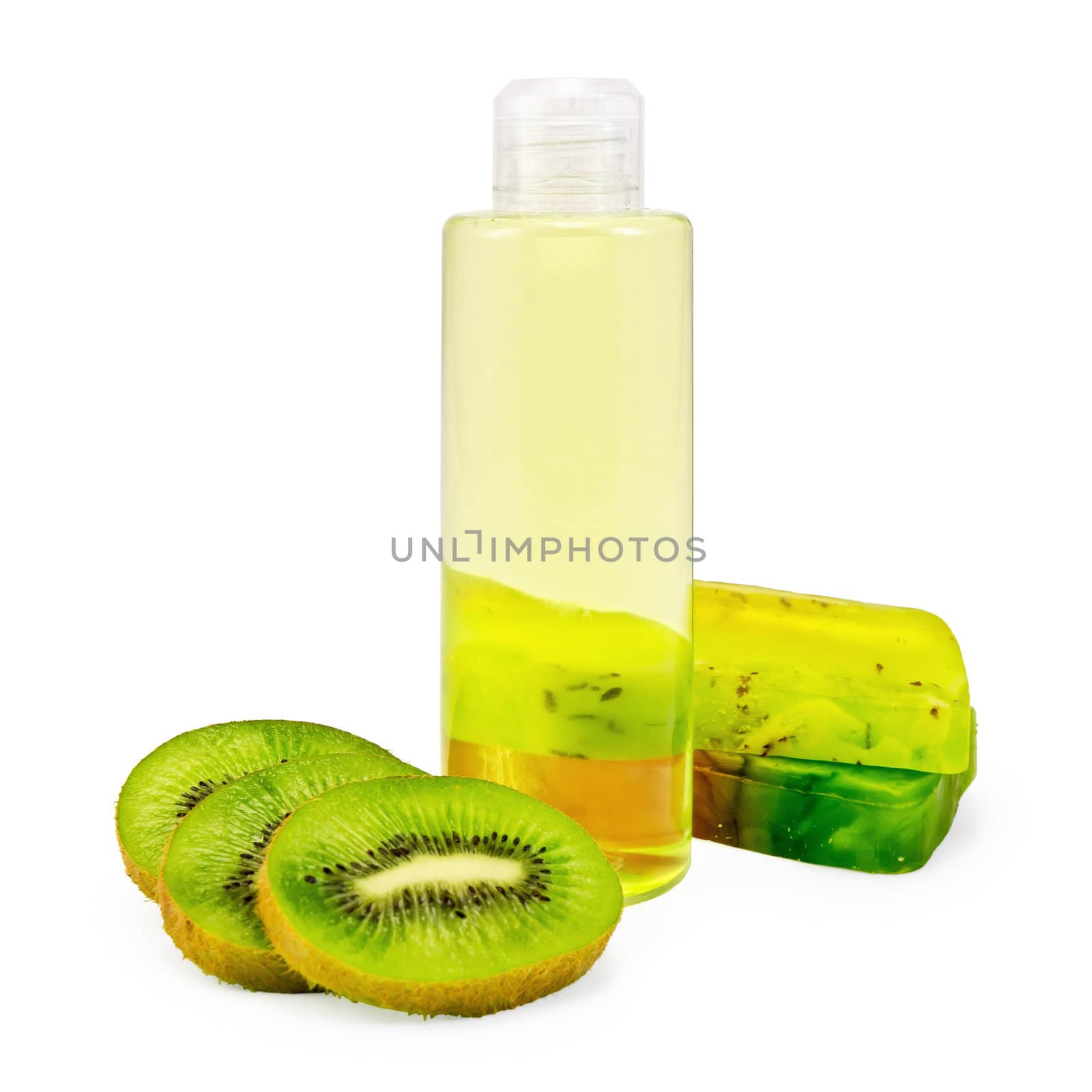 Bottle of shower gel, two bars of homemade green soap, a few slices of kiwi isolated on white background