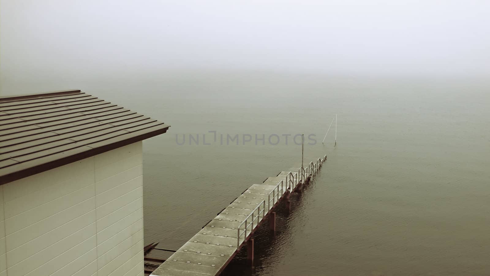 old pier in mist by yuriz