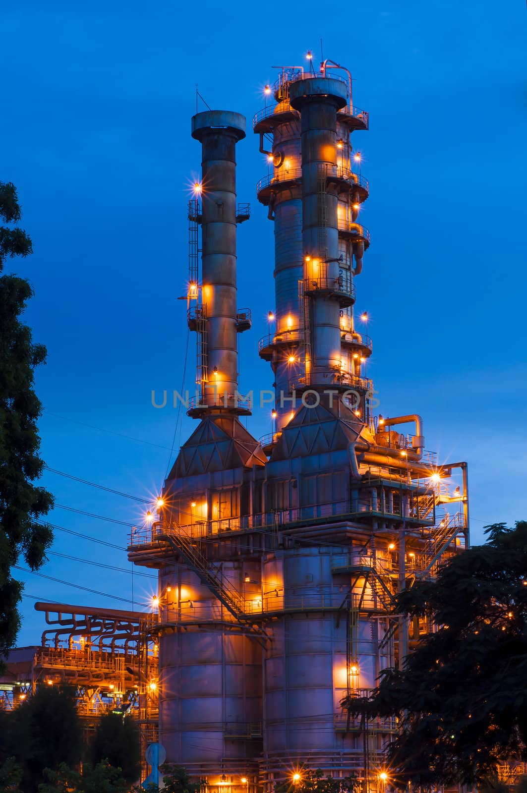 Oil refinery at twilight with blue sky