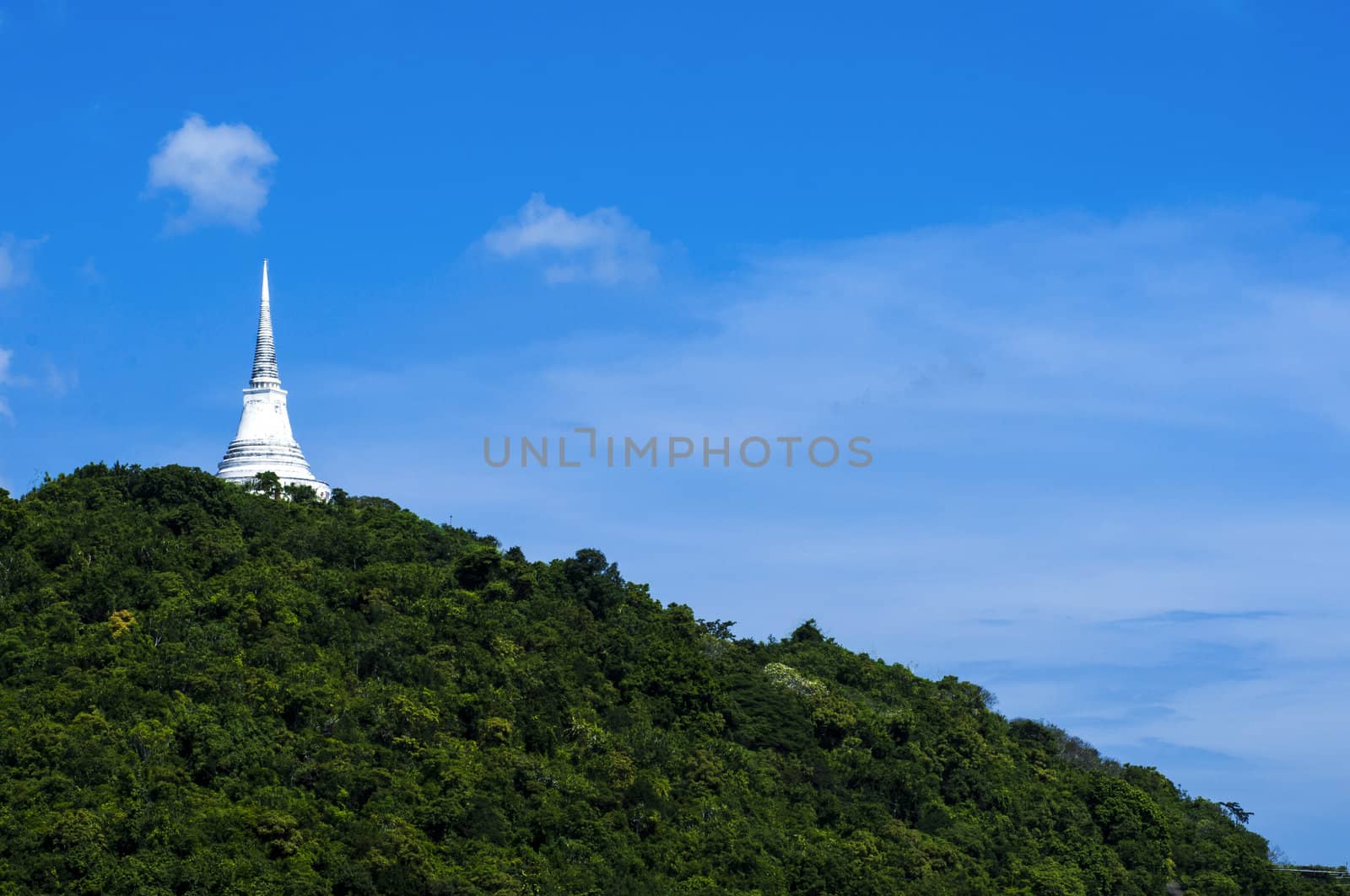 white stupa on mountain by TanawatPontchour