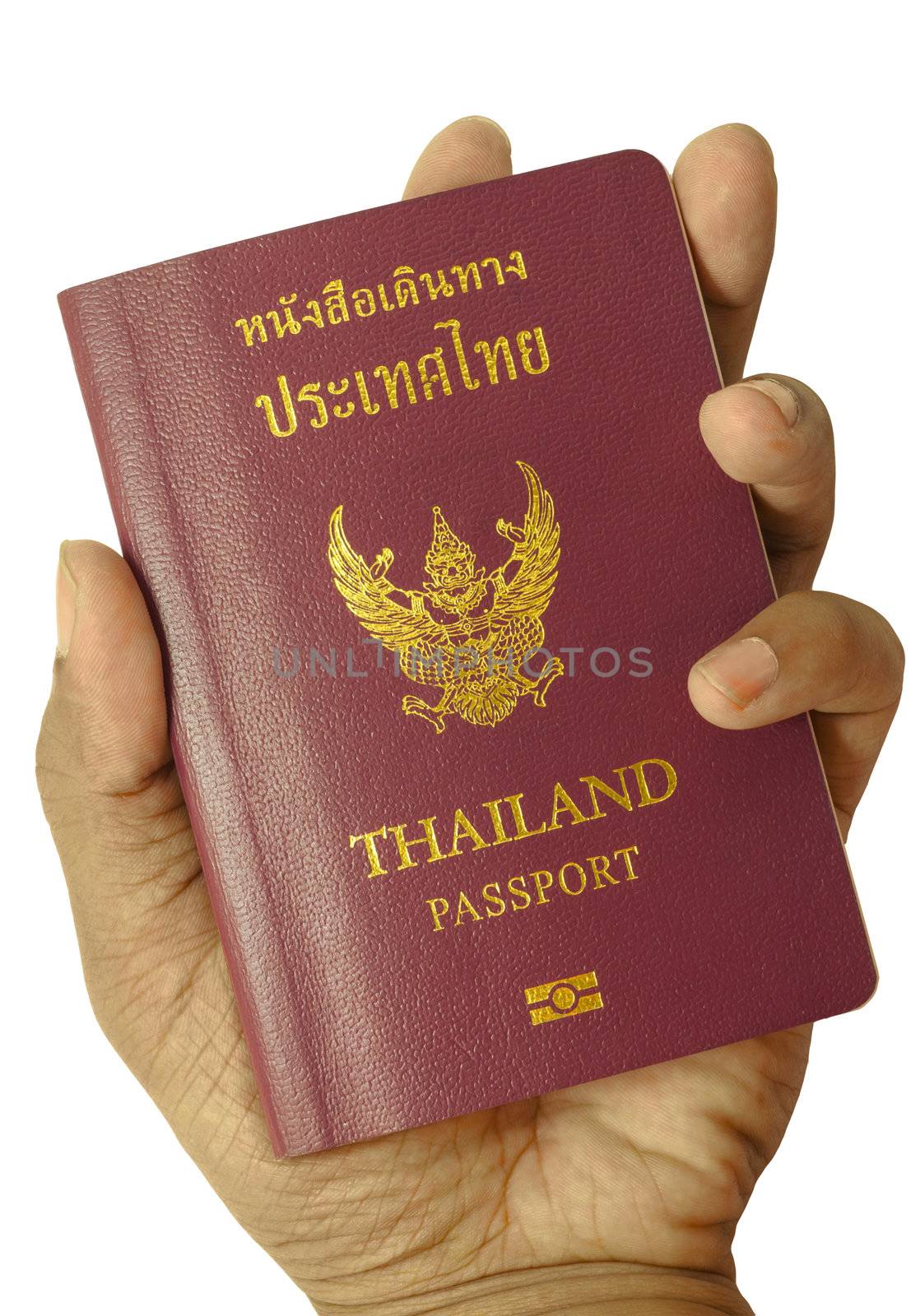 Hand holding Thailand passport by TanawatPontchour