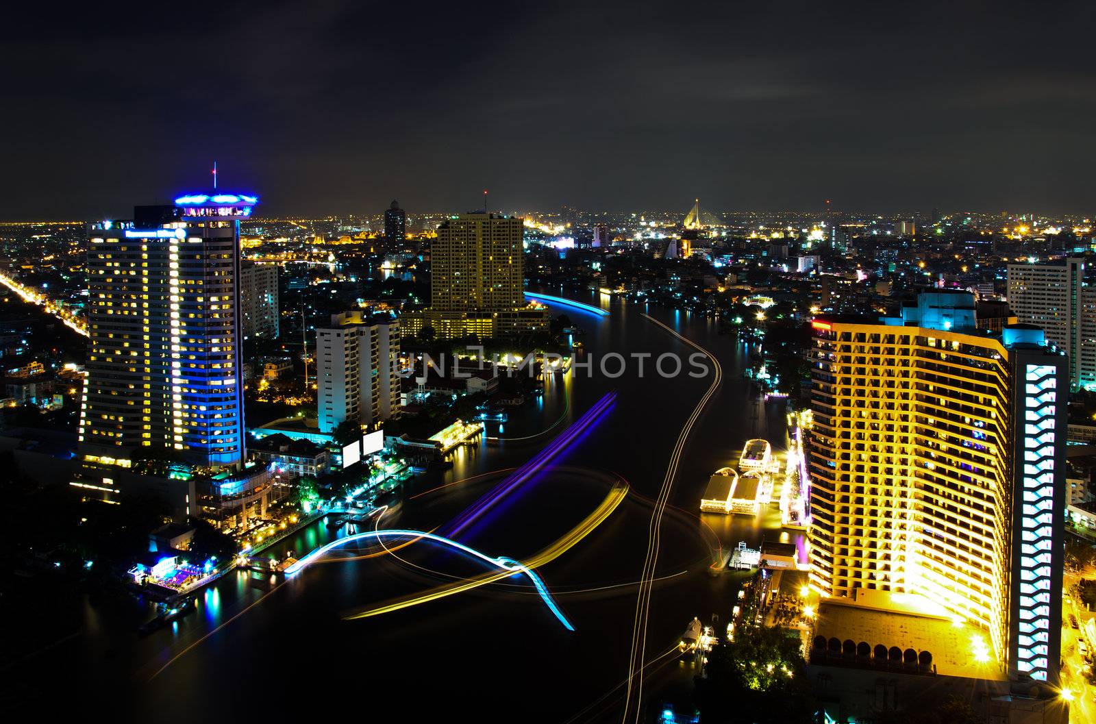 Bangkok City at Night, the light from of the ships in the river, Thailand.